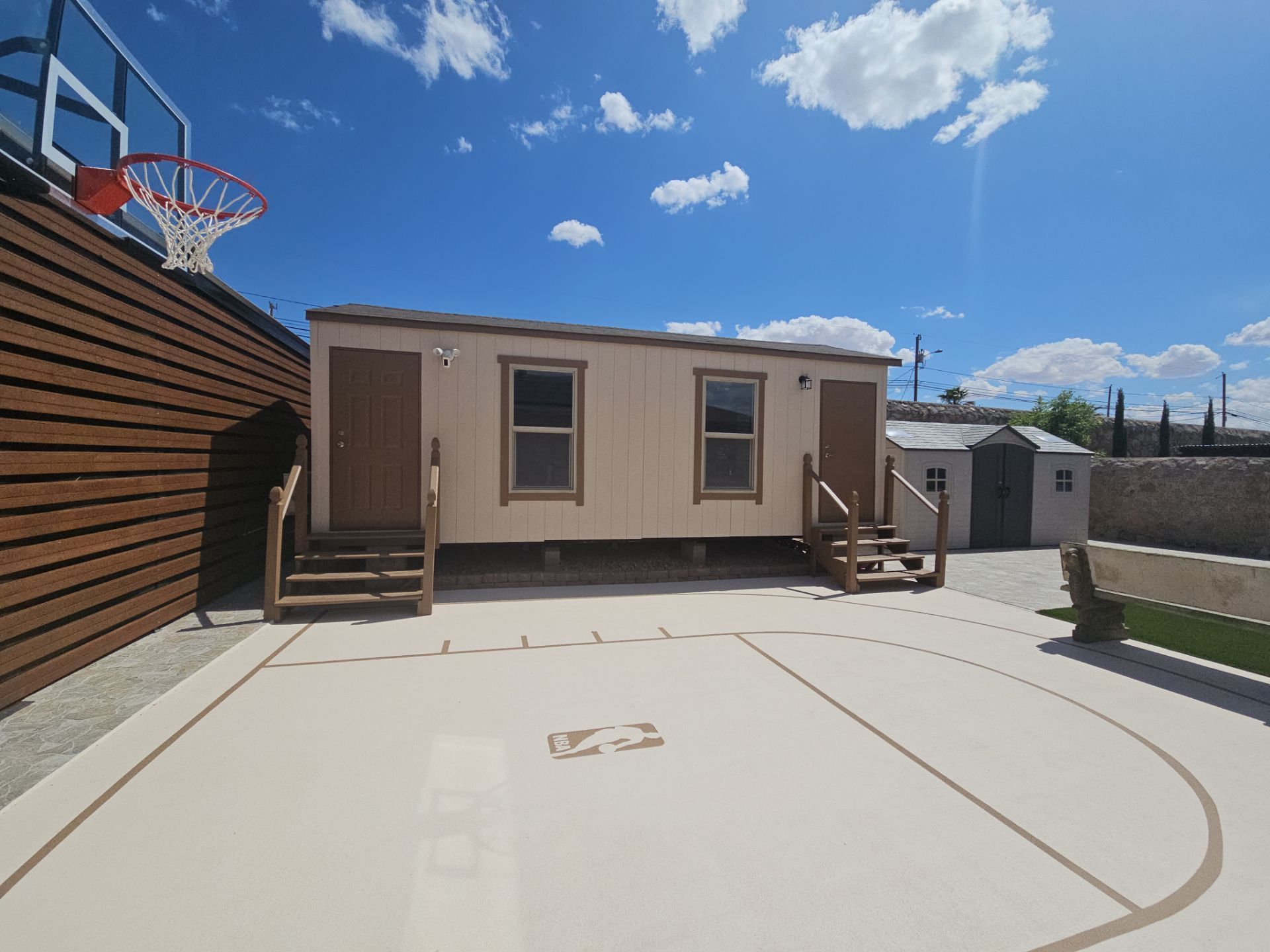 Exterior Building Painting and Repairs with Basketball Court and Playground  by Regal Renovate