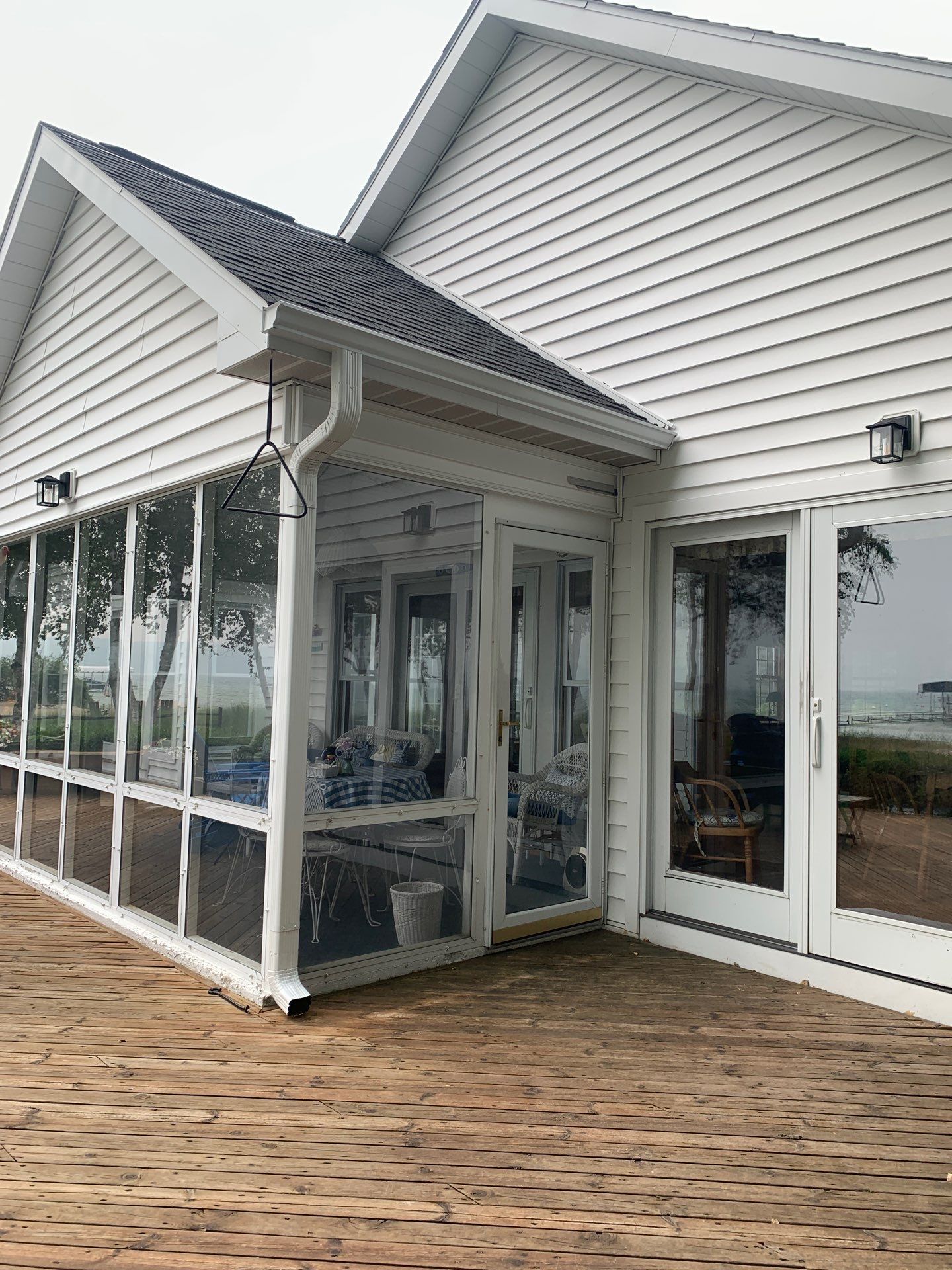 Seamless Gutter Installation for Frankfort Home and Sunroom by Rainbow Seamless Systems