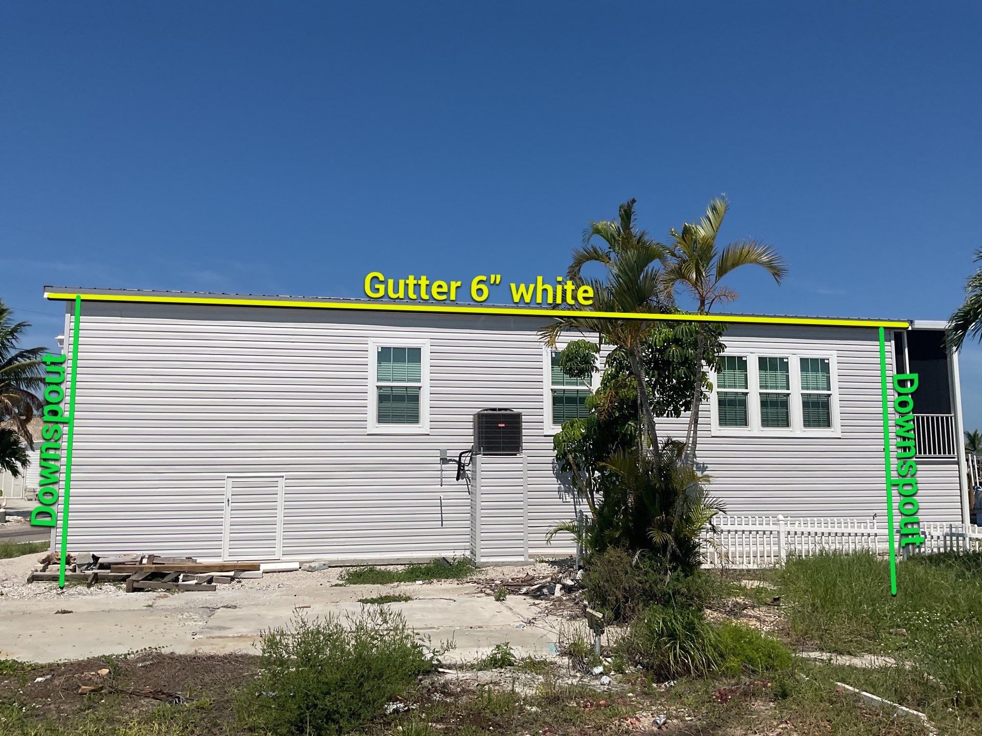 White Downspouts Installation in St. James City by Gutter Professors