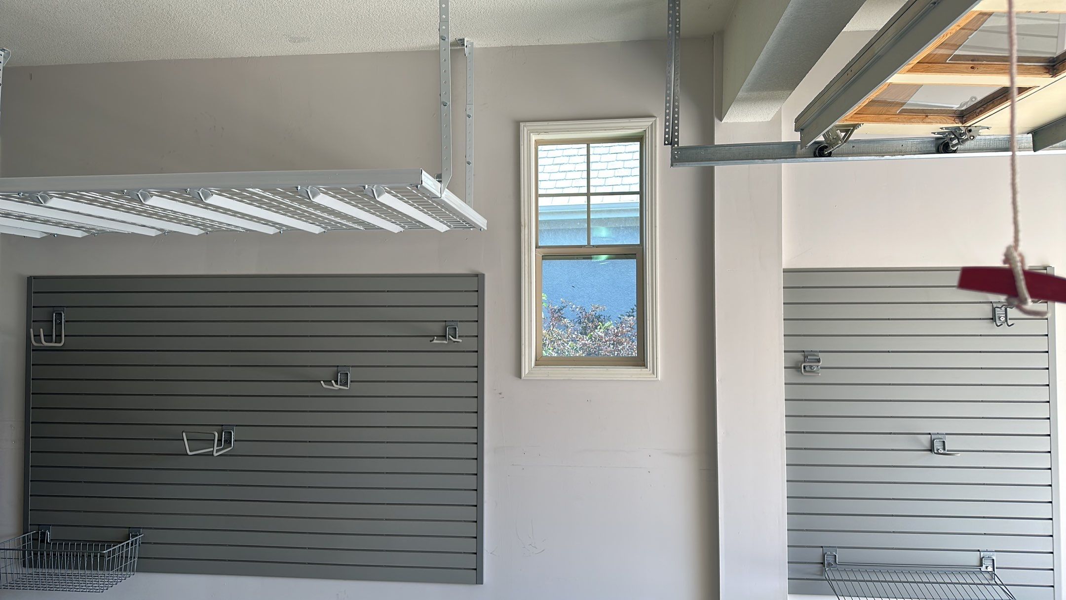 Lori H. upgrade her garage with cabinets and overhead racks by Banner Garage