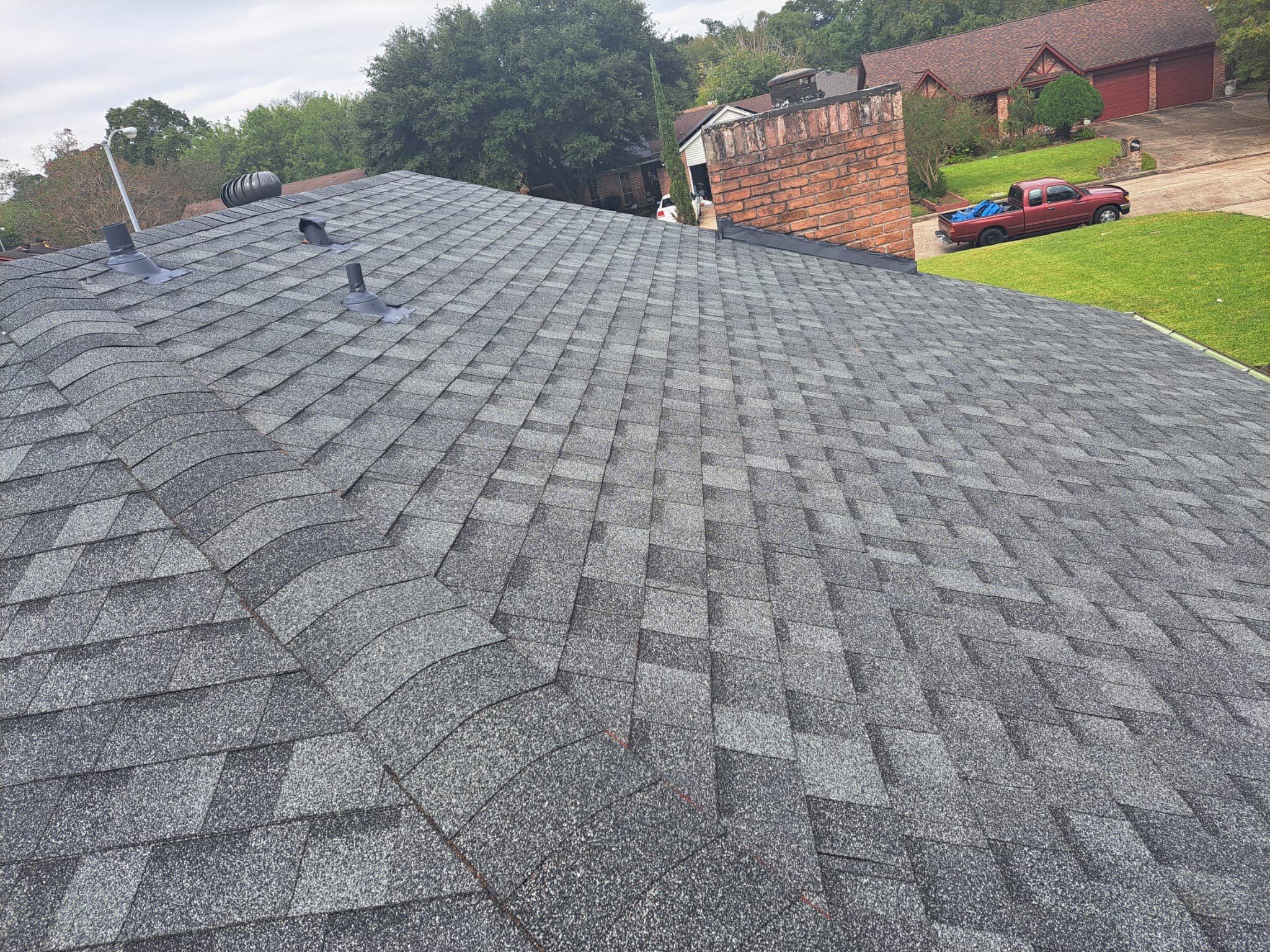 New Gray Shingle Roof on Brick Home — Houston, TX by PL Roofing & SB Roofing, LLC.