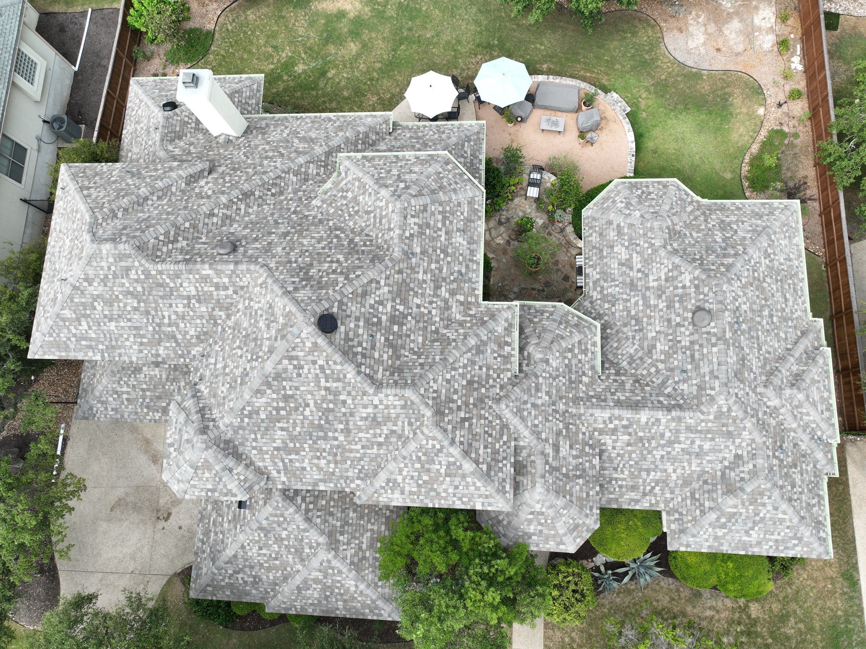 Residential Roof Replacement using 30 Year Laminate Shingles with High Profile Ridge by Premier Roofing and Contracting
