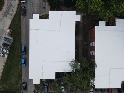 Commercial Flat Roofing System - PVC Membrane & Fluid Applied Coatings