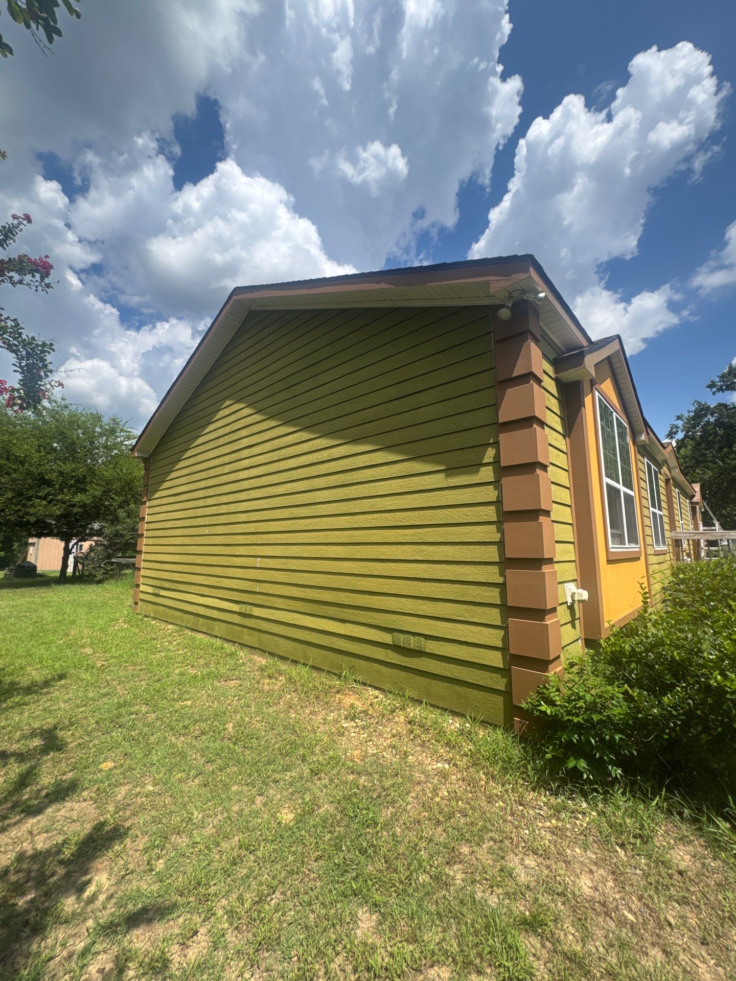 Exterior Painting in Lindale, TX | Bright Green Wood House Repaint by Quality Coats Painting