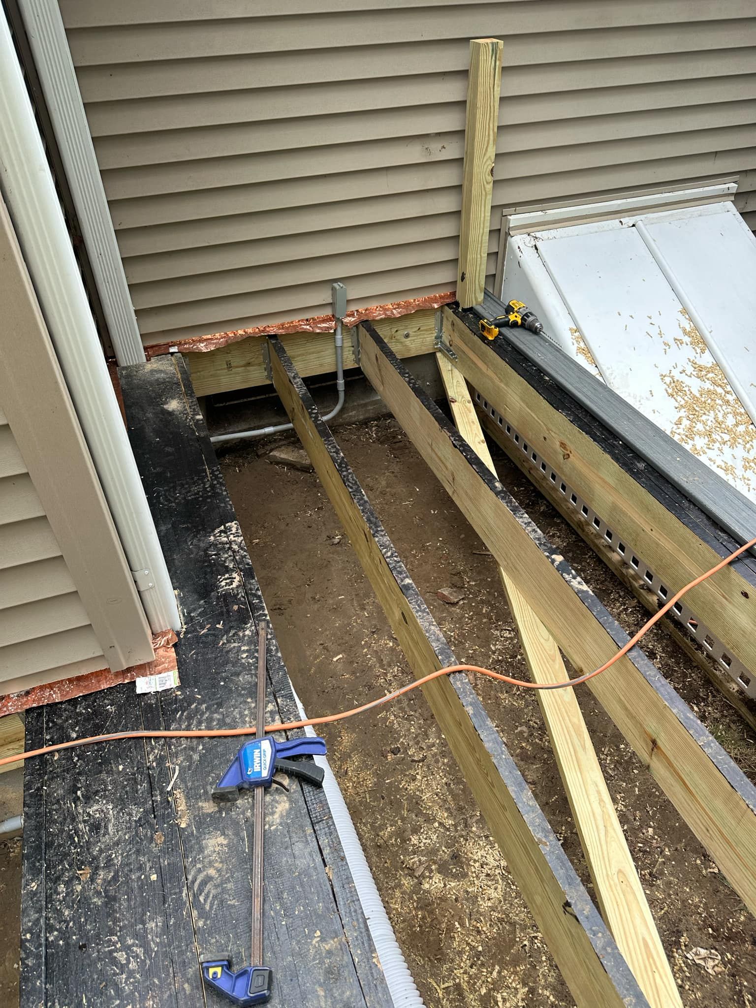 Deck Replacement with Trex Tropical Island Mist , matching cocktail rail and lattice bottom by DiGiorgi Roofing and Siding Inc