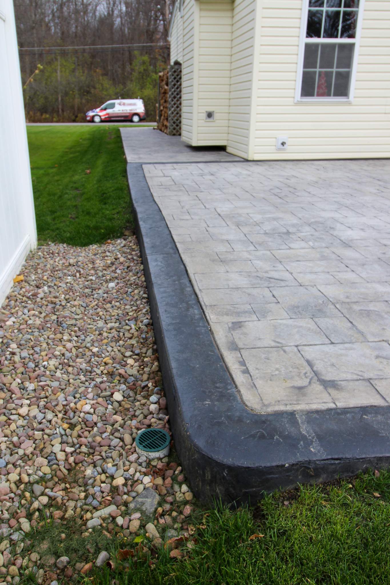 Stamped Concrete, Entry Door, and Concrete  by Ivy Lea Construction