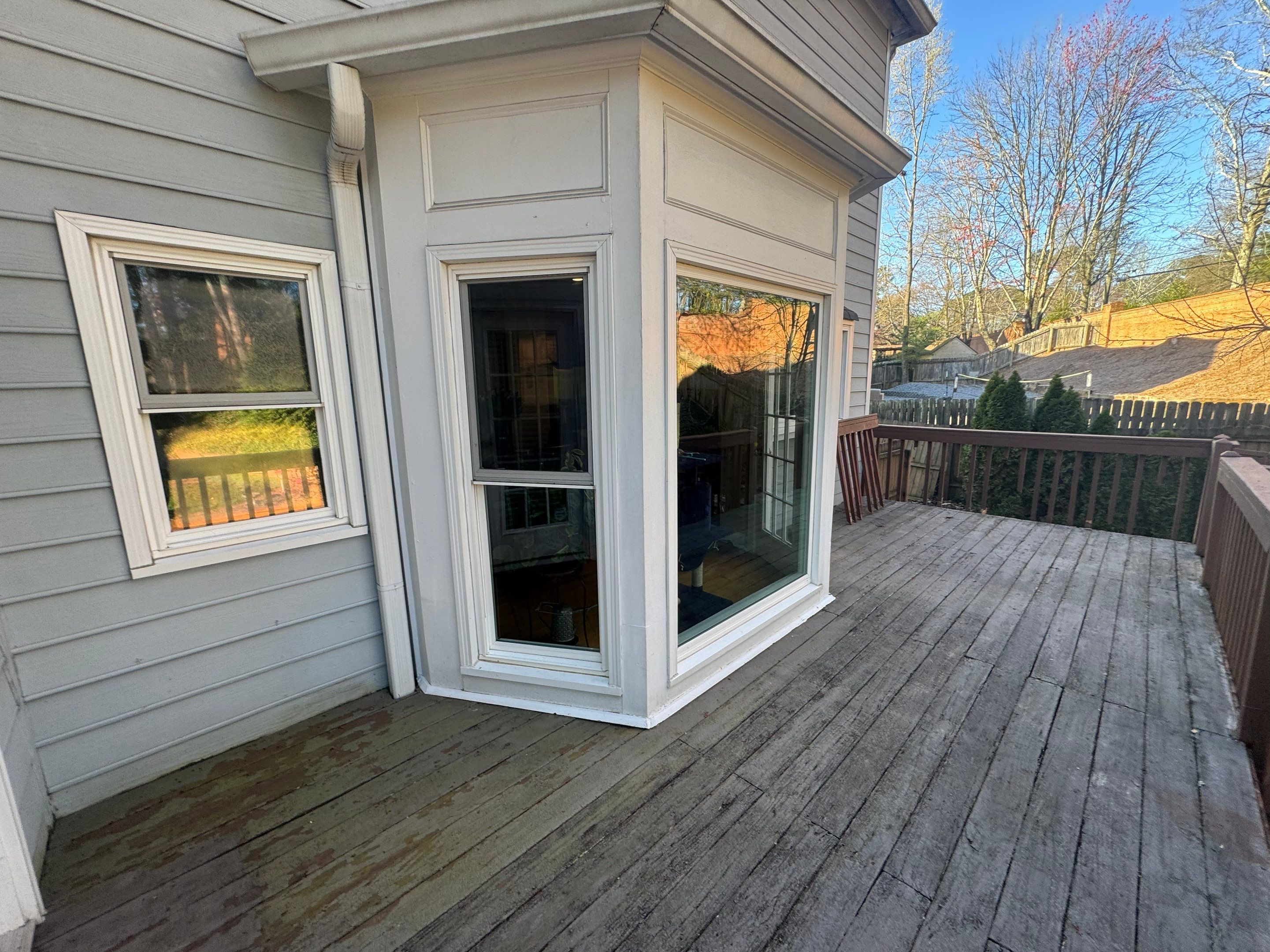 Elevated Deck Replacement with Black Metal Railings in Johns Creek by Swift Home Renovations