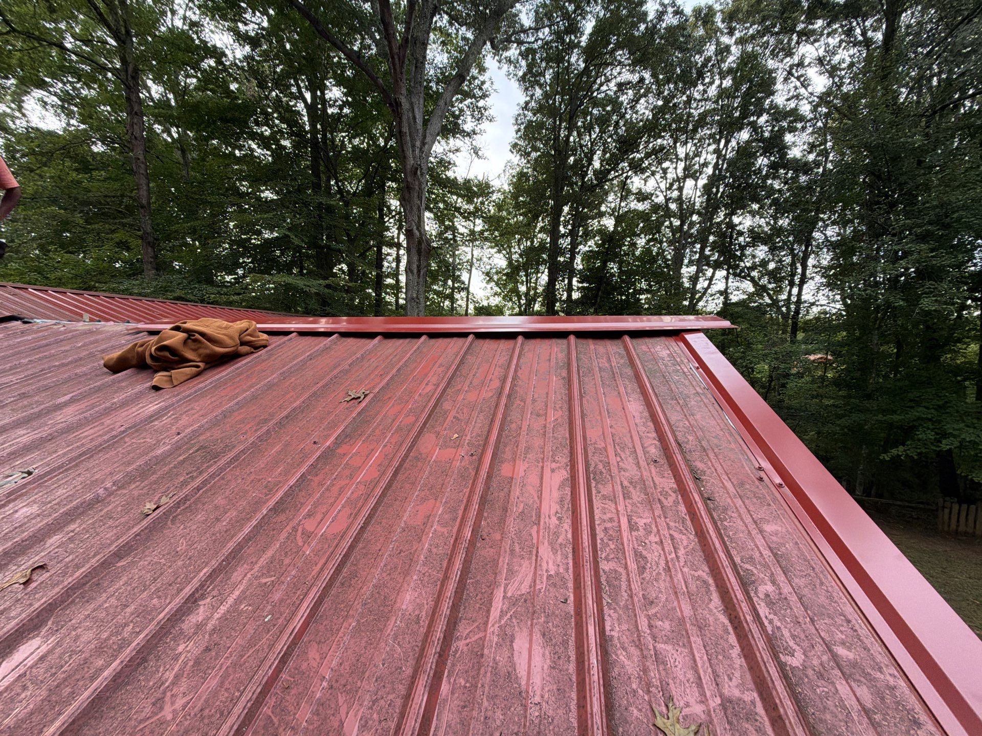 Red Metal Roof Restoration and Wood Fascia Replacement in Barboursville by Cade Construction