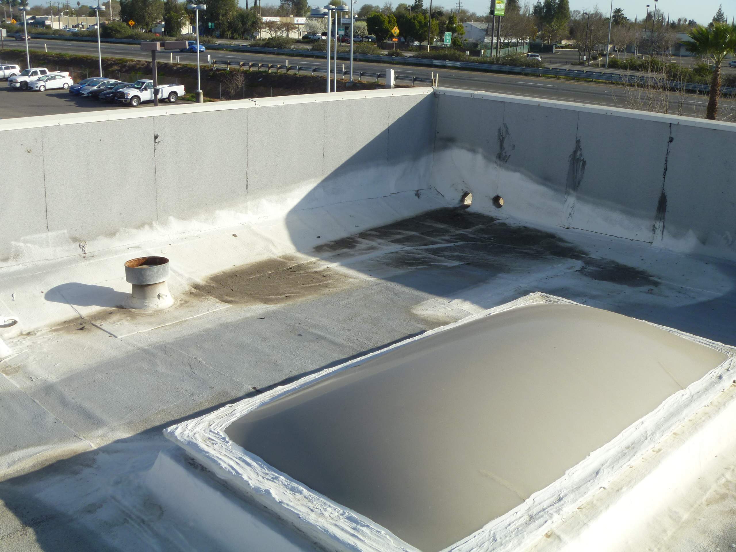 Commercial Roofing Installation using Spray foam and Conklin Benchmark/PUMA XL 18 yr warranty coatings by Straight Edge Roofing Inc