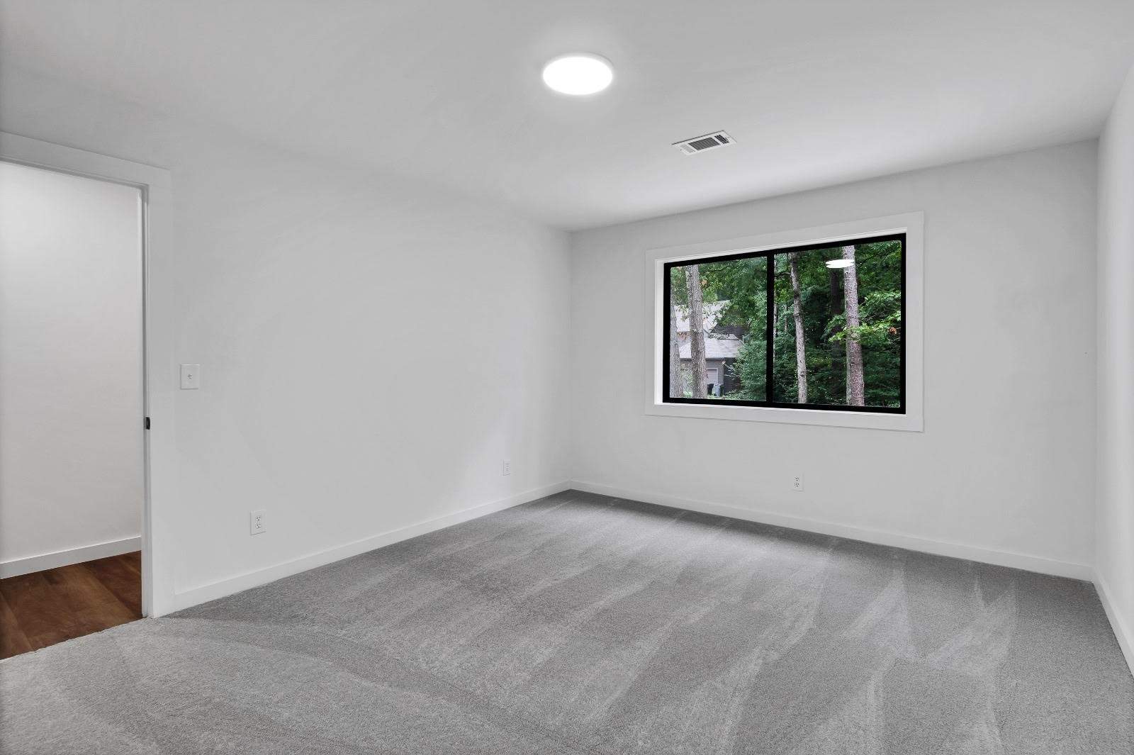 Modern Marietta Home Transformation with Custom Kitchen and Vertical Siding by Swift Home Renovations