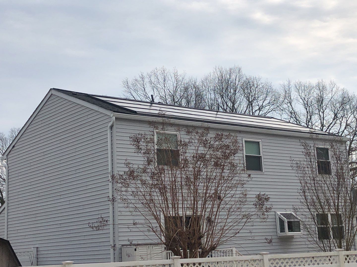 Roof Replacement with GAF Decotech integrated solar panels by American Home Contractors