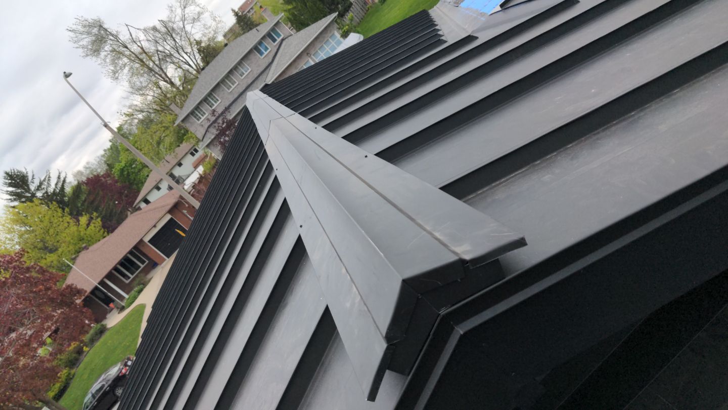 Residential Roofing Installation using 16" Standing Seam Panels by Jay Carter Roofing & Sheet Metal