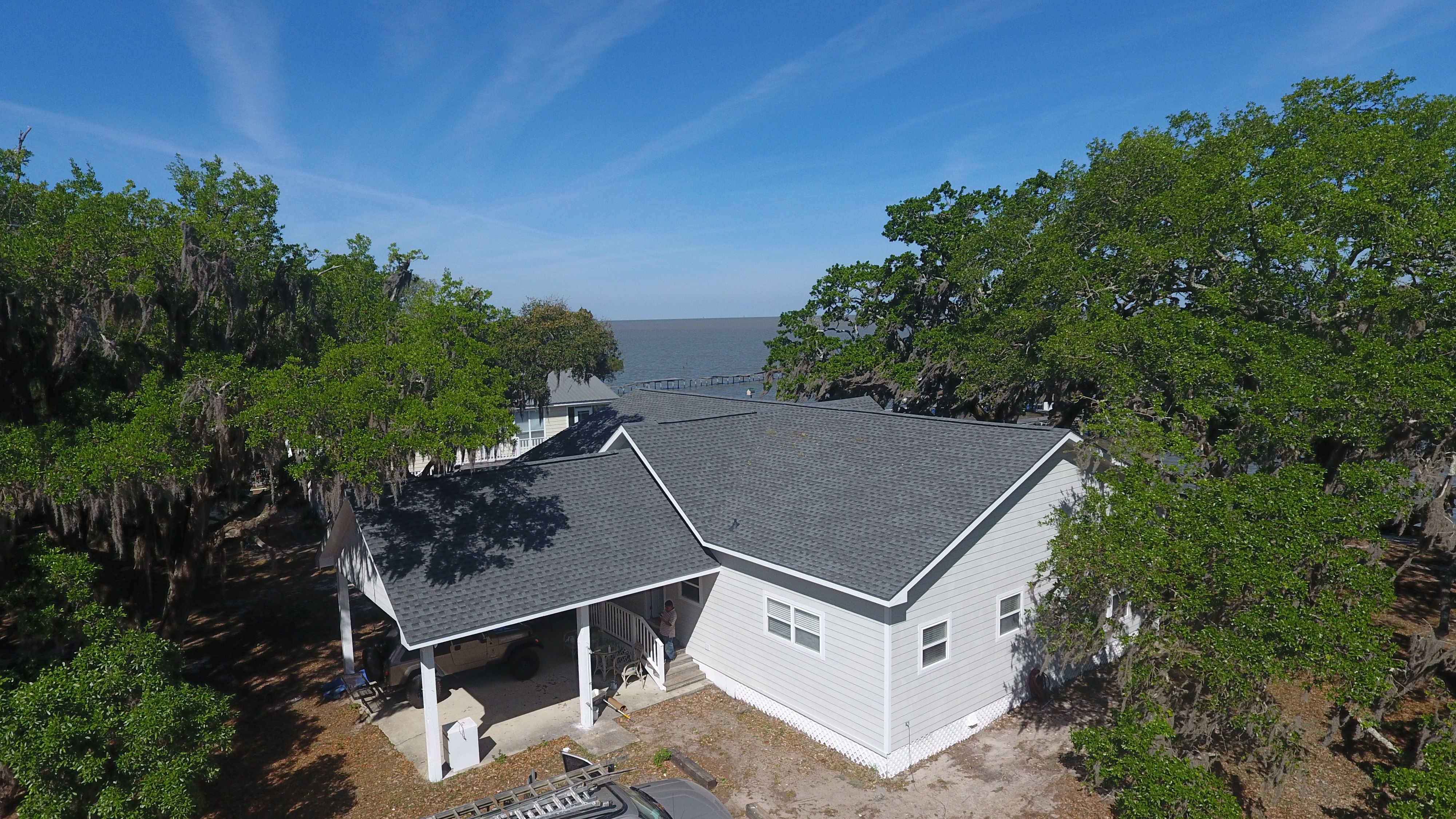 Residential Roofing Installation using Roof Replacement by American Roofing & Construction LLC
