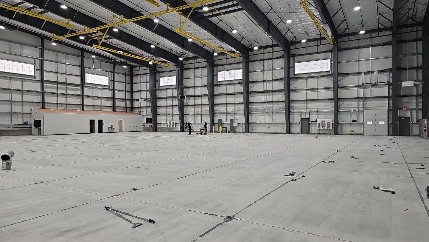 Airplane Hanger using Light Grey Commercial Penntek Epoxy by Croc Coatings, LLC