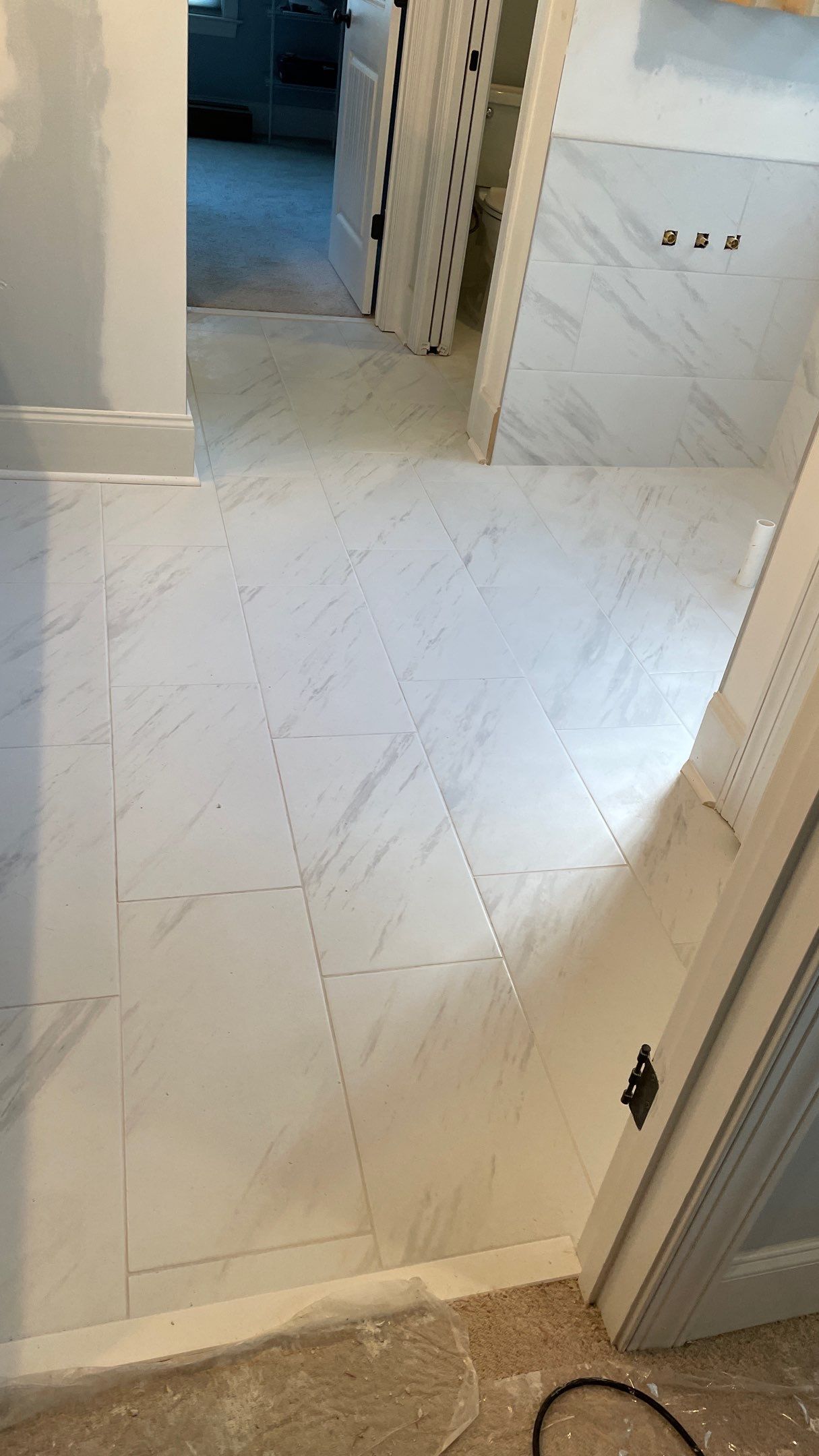 Bright Bathroom Remodel with Wall Removal, Stand Alone Tub and New Vanity by Footprints Floors of Coastal Carolina