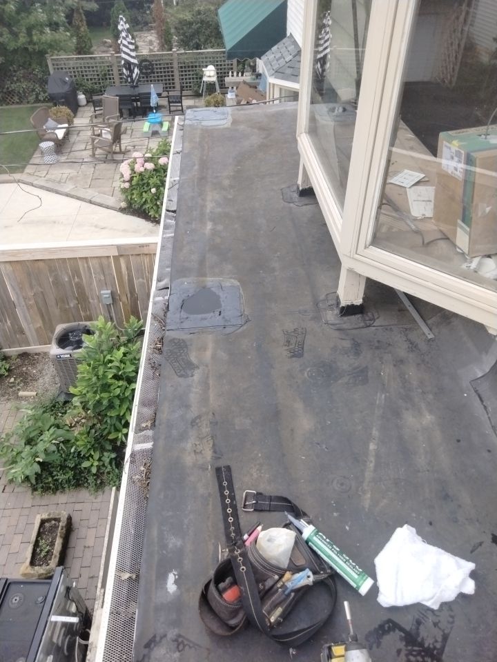 Residential Roofing Installation, Dec-tek walk-out porch roof, siding on garage by Absolute Roofing and Construction