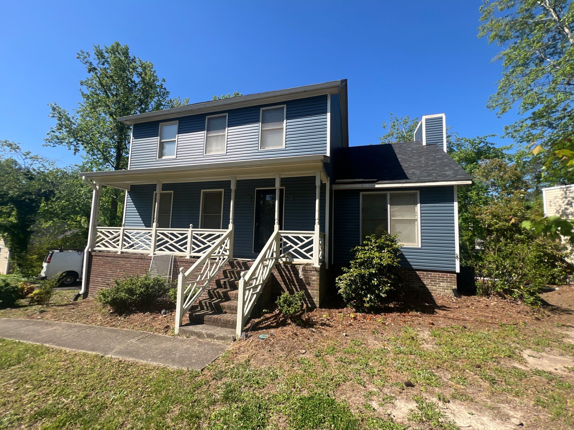 Blue Vinyl Siding Replacement and Exterior Trim Update in Durham by The Remodeling Company