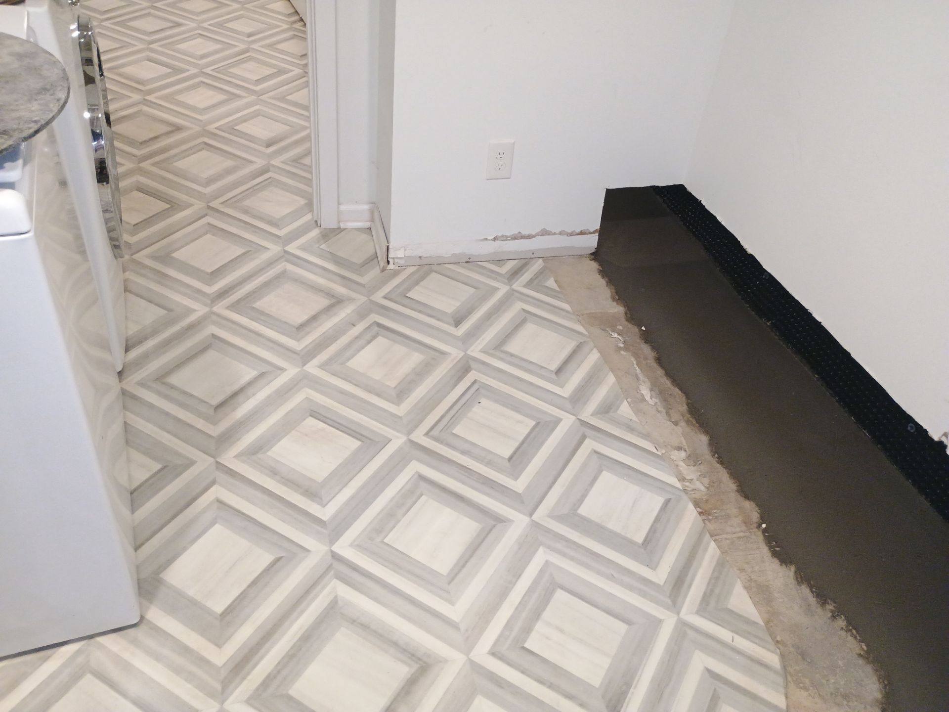 Interior Drain Tile & Buried Discharge in St. Anthony, MN by Waterproofing Northeast