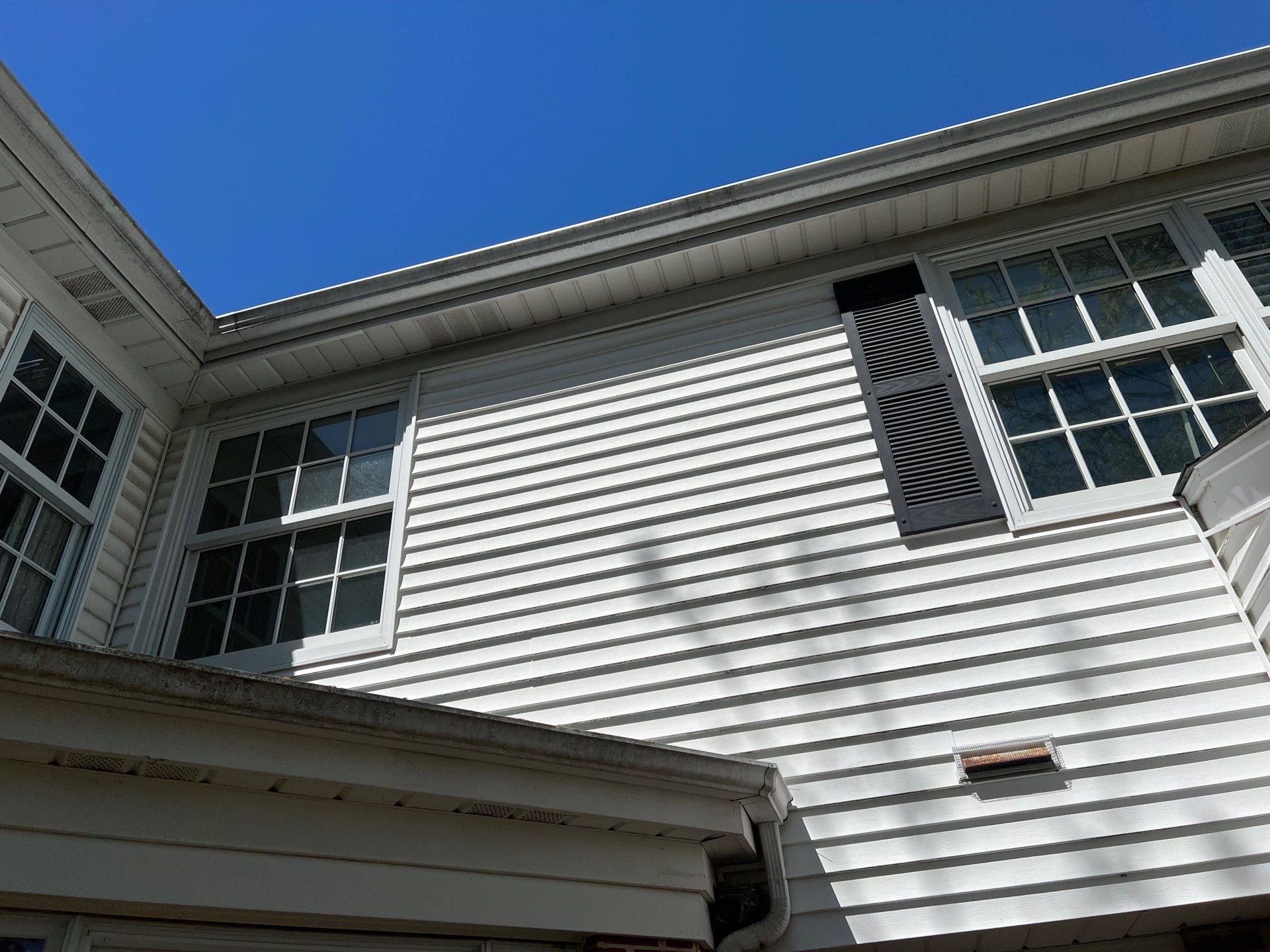 Housewashing  using Algaecide, soft wash soap by Northern Power Washing LLC.
