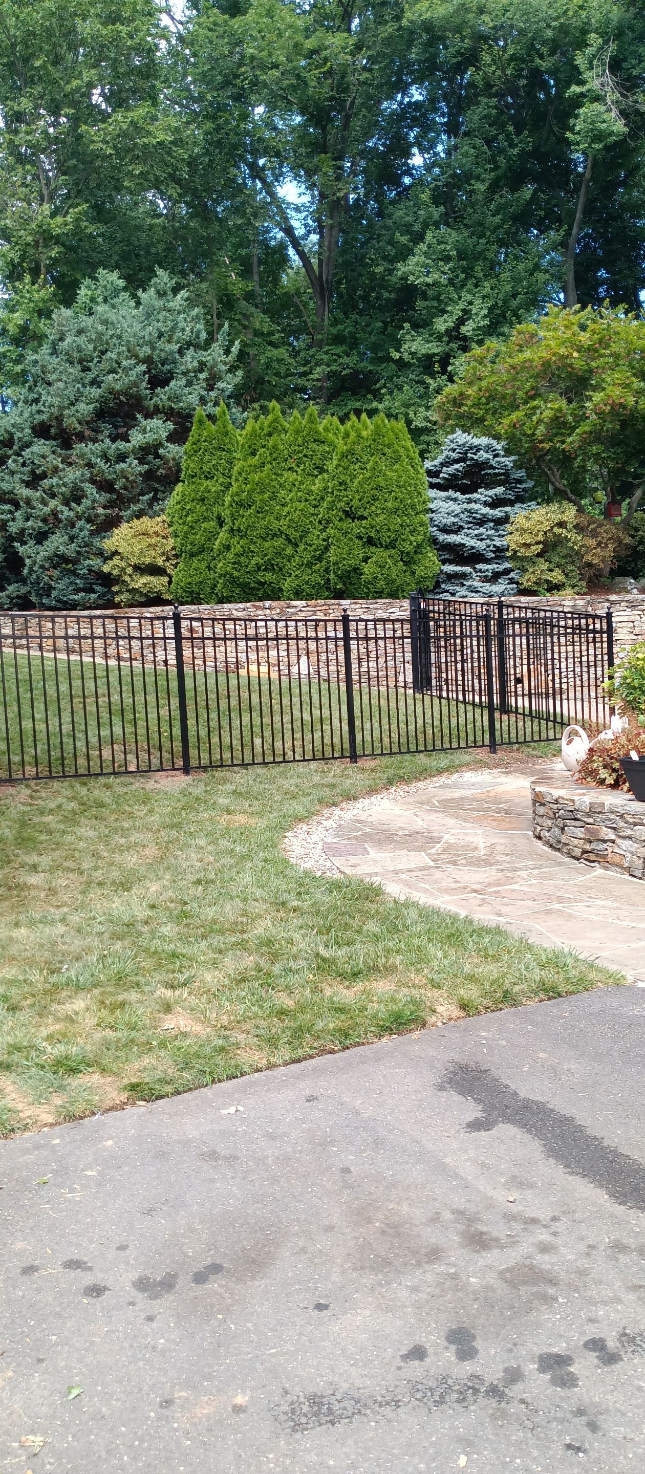 New Black Aluminum fence with matching gates by DiGiorgi Roofing and Siding Inc
