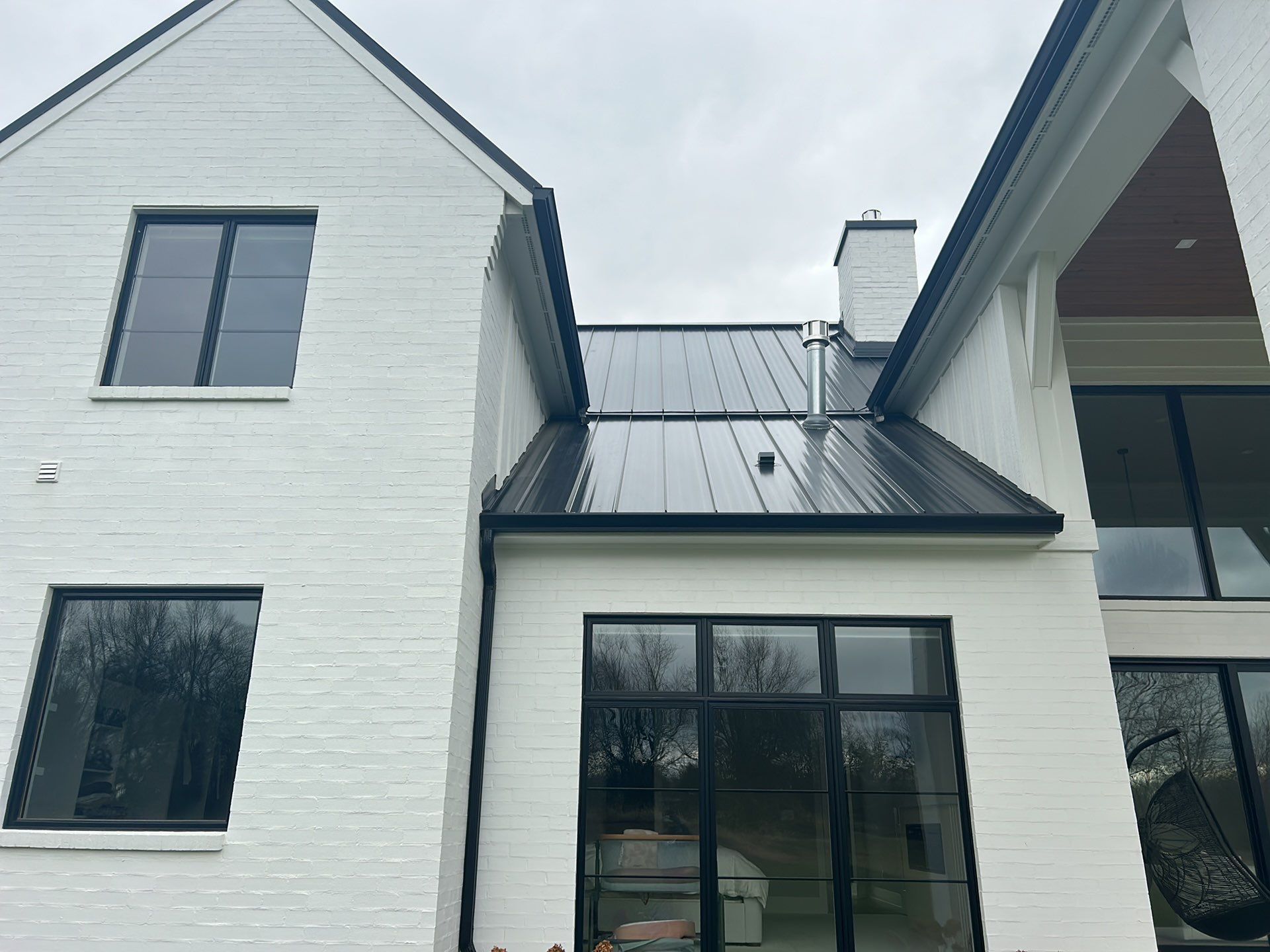 Residential Roofing Installation using Standing Seam Metal - Frost Black by RoofX 