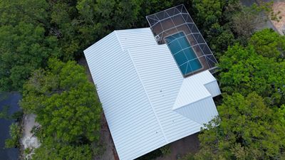 Residential Roofing Installation using 032 Aluminum Standing Seam Metal Roof