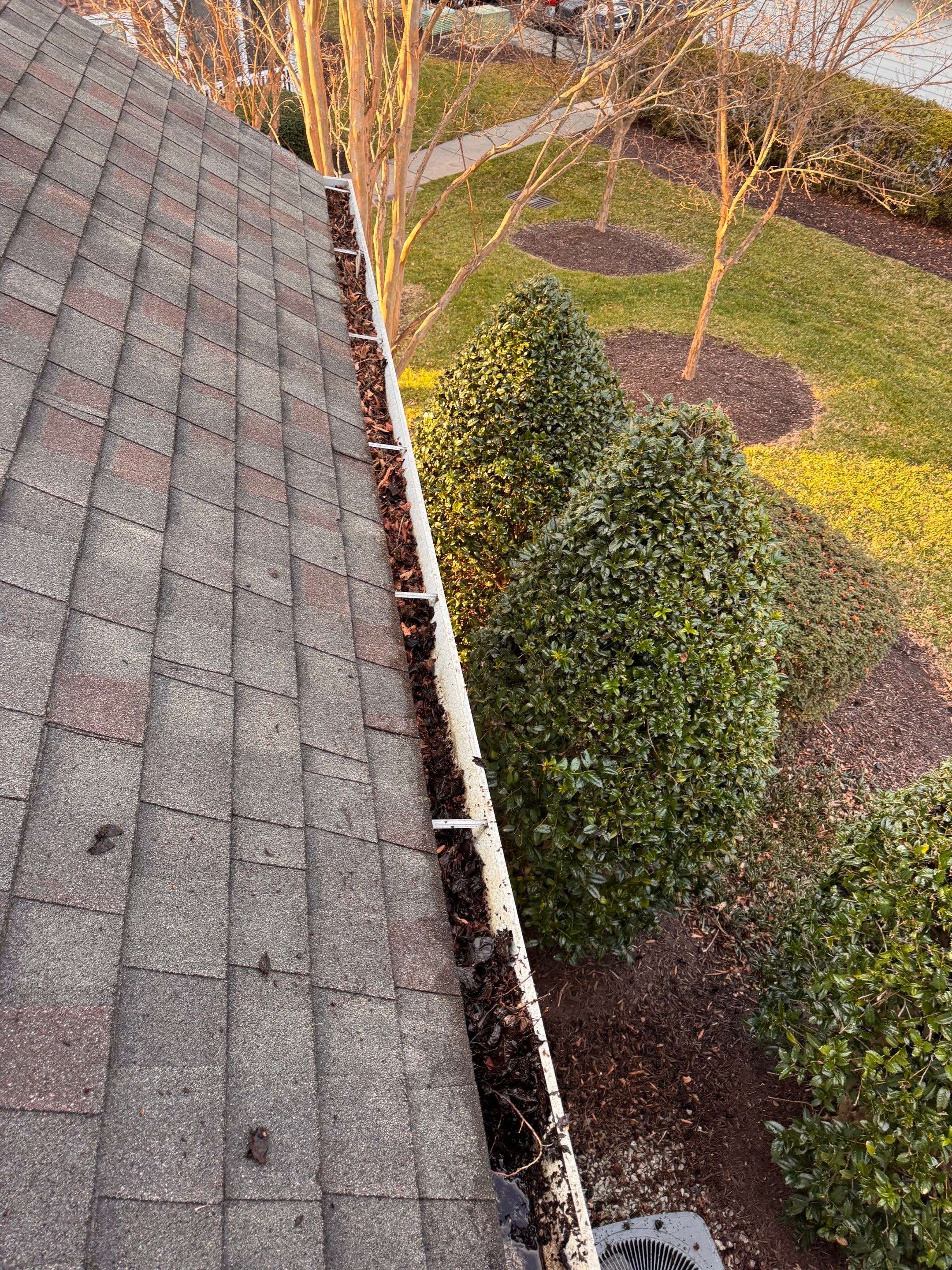 Commercial gutter cleaning Durham, NC before photo with filled gutters