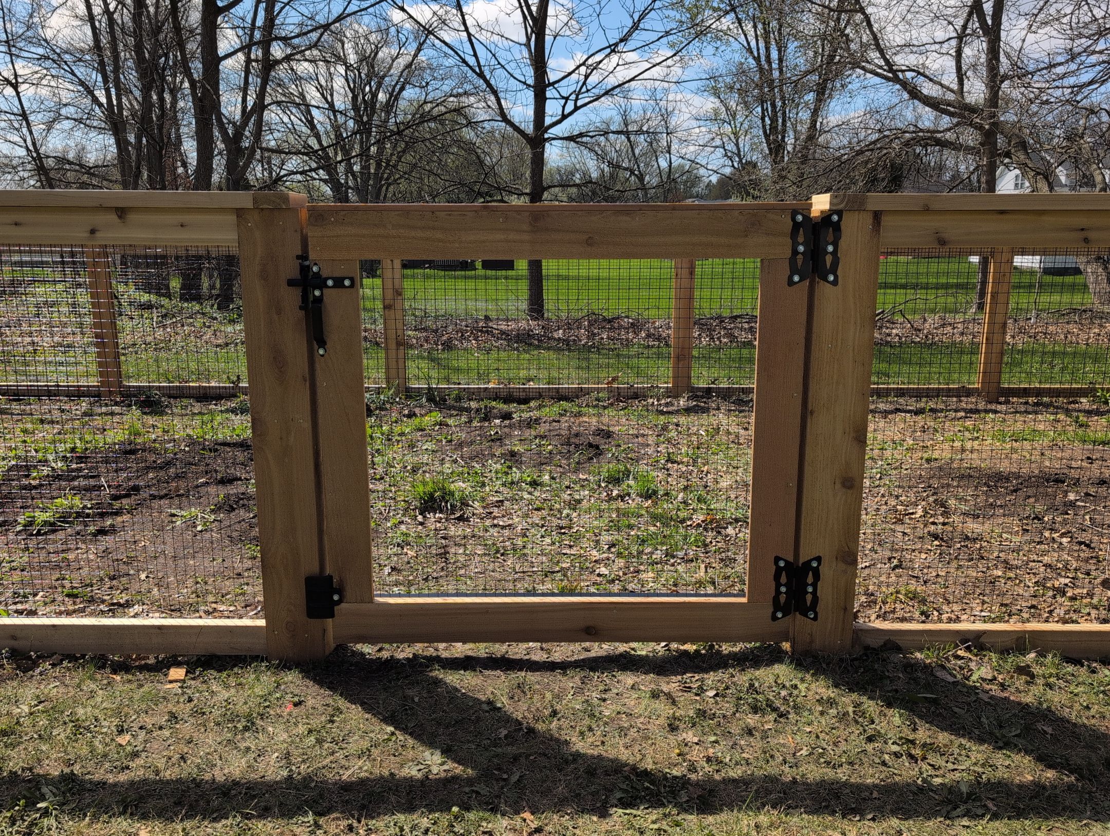 Custom Cedar Wood Garden Fence Installation in Cedar Falls by Perfect Picket Fence and Stain