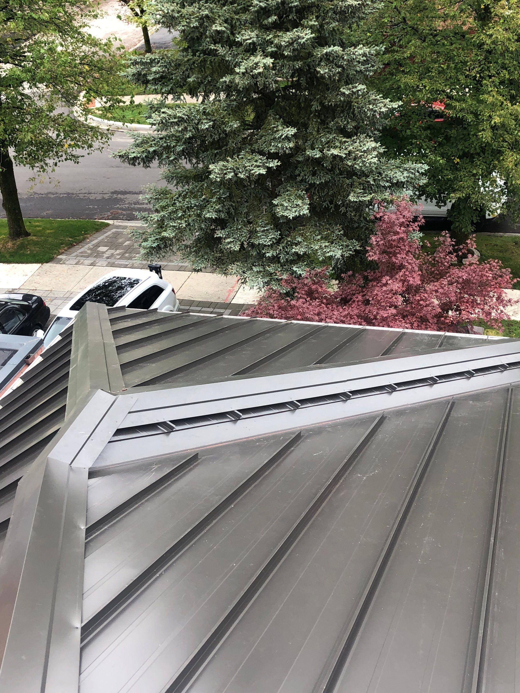 Residential Roofing Installation using 16" Standing Seam Panels by Jay Carter Roofing & Sheet Metal