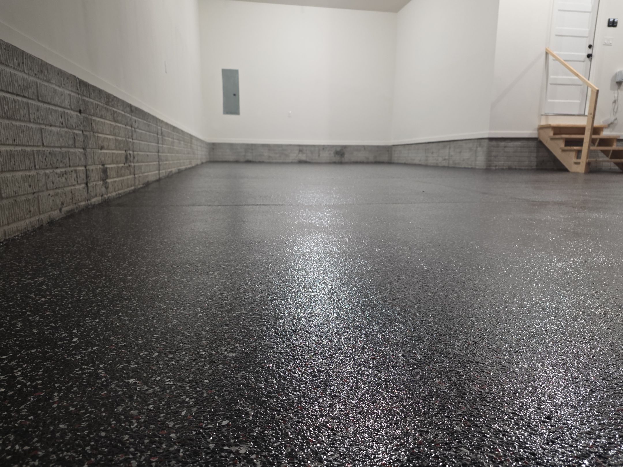 Husker-Style Garage by Revival Concrete Coatings
