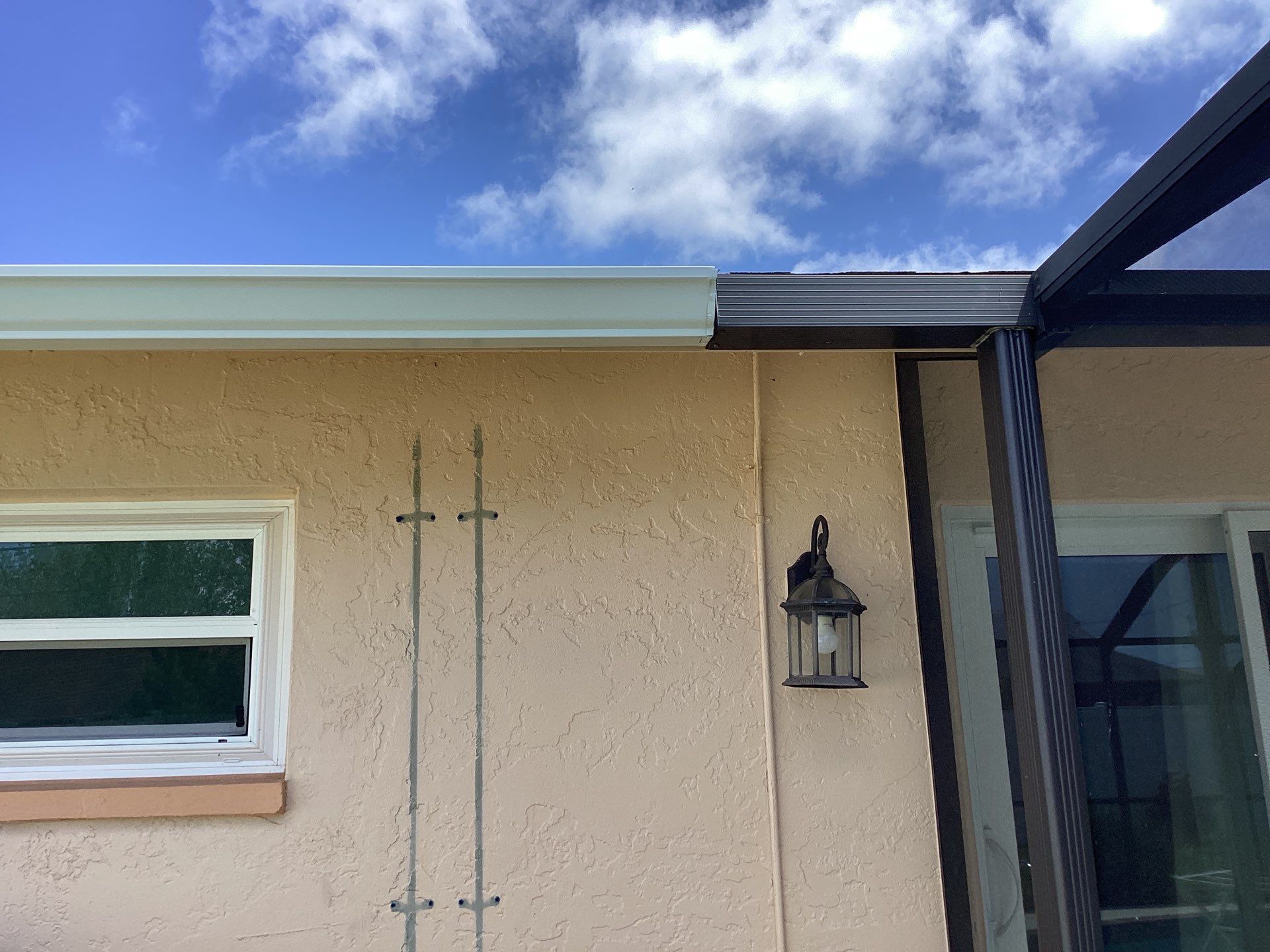 White K Style Seamless Gutters using 3X4 Elbow Downspout in Cape Coral FL by Gutter Professors