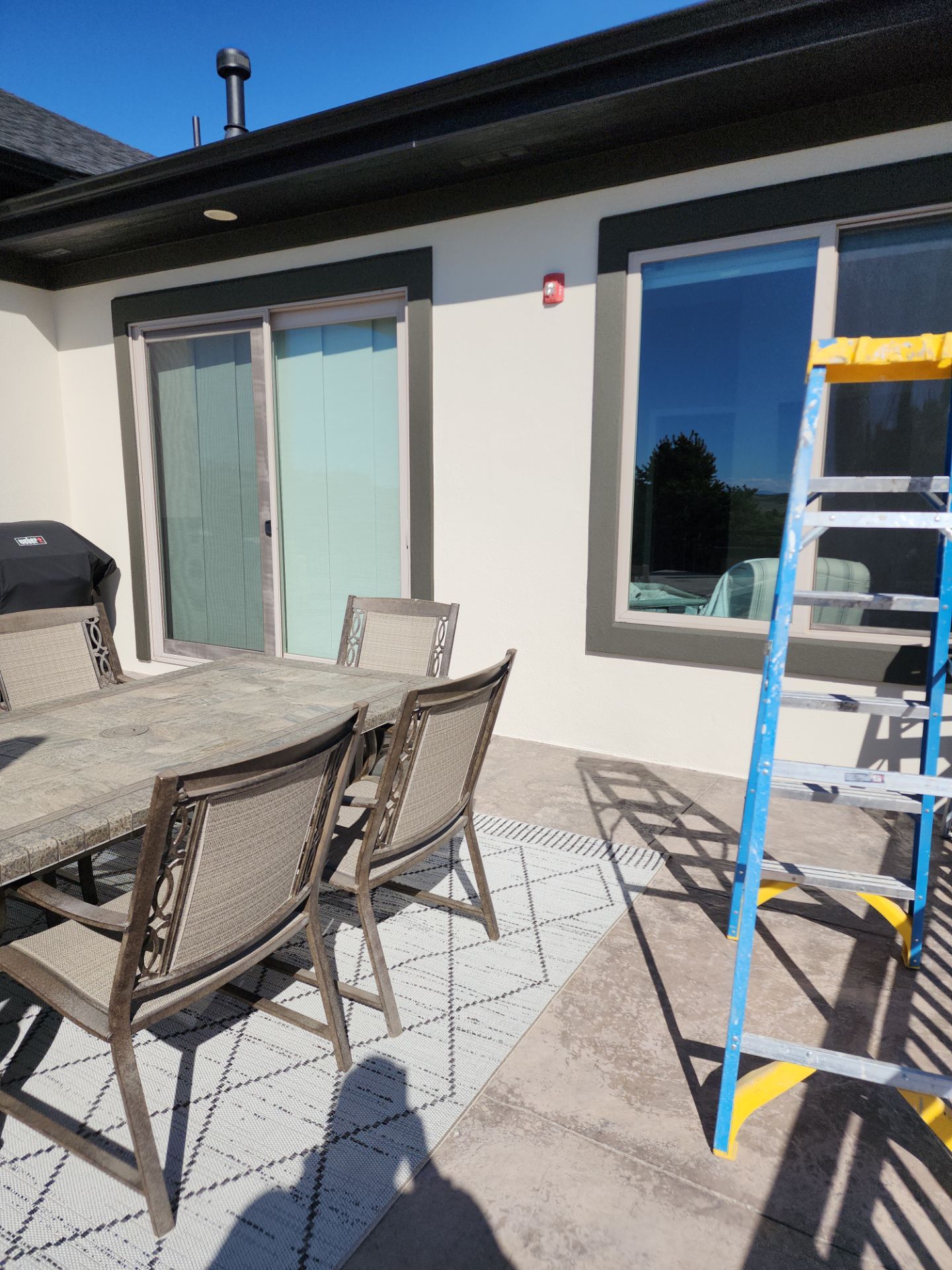 Castle Rock Elegance: White Stucco Exterior with Bold Tricorn Black by J&M Painting LLC