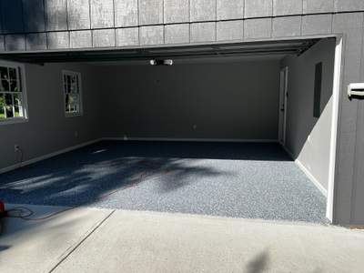 Snellville Garage Remodel Featuring Epoxy Floors and Board and Batten Siding