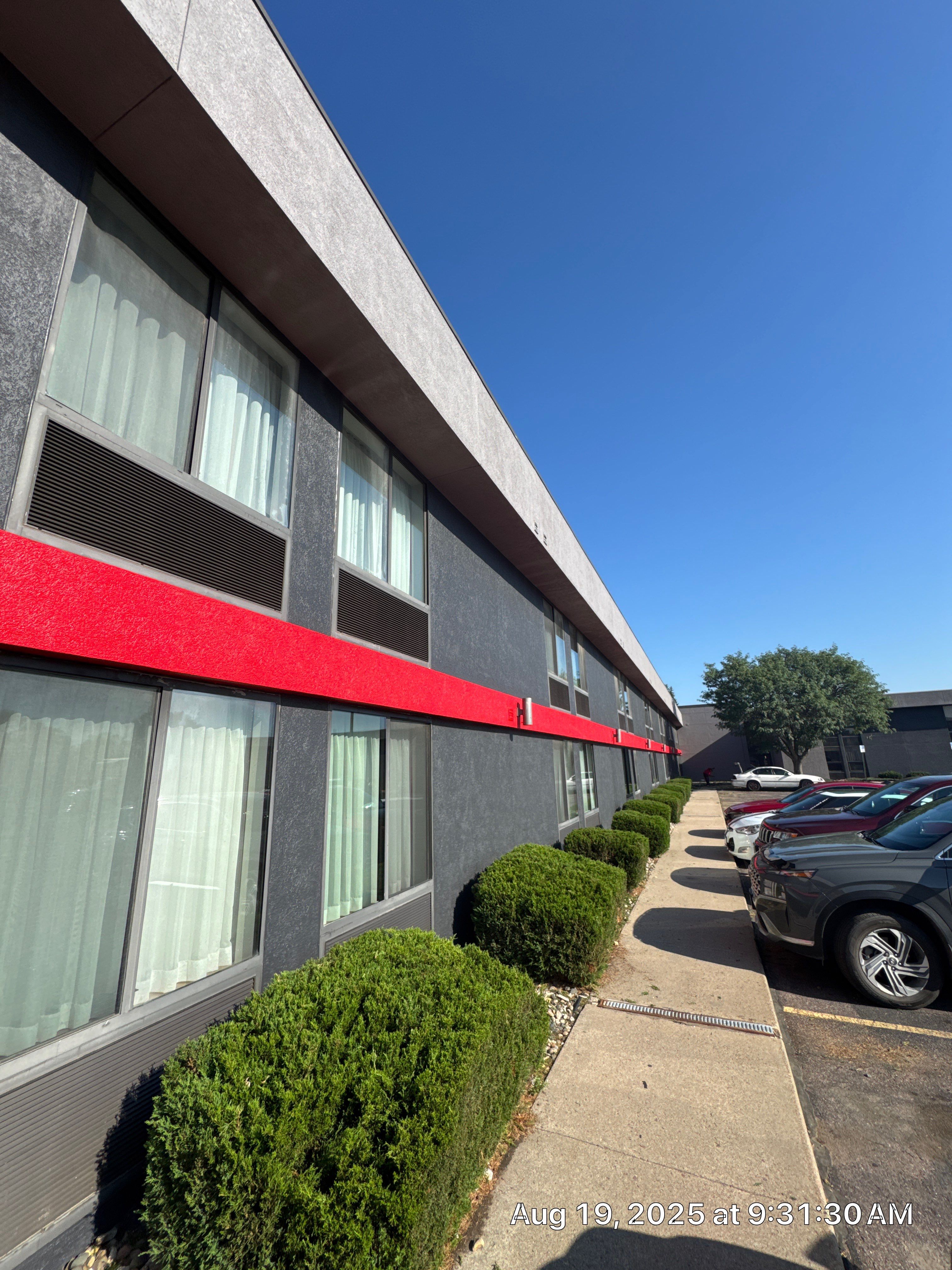 Commercial Exterior Painting with Stucco and Bold Red Accent Trim by Select Painting, Coatings & Garage Cabinets