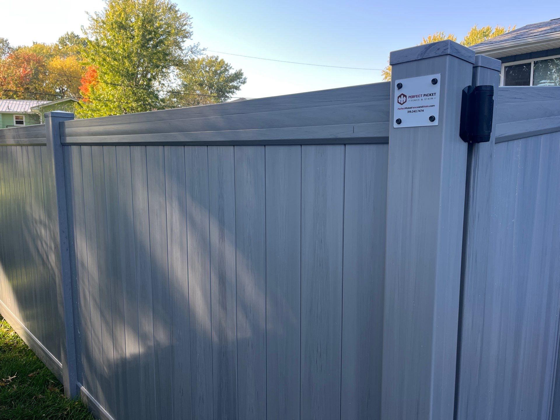 Chai Gray Vinyl Privacy Fence and Gate Installation in Cedar Falls by Perfect Picket Fence and Stain