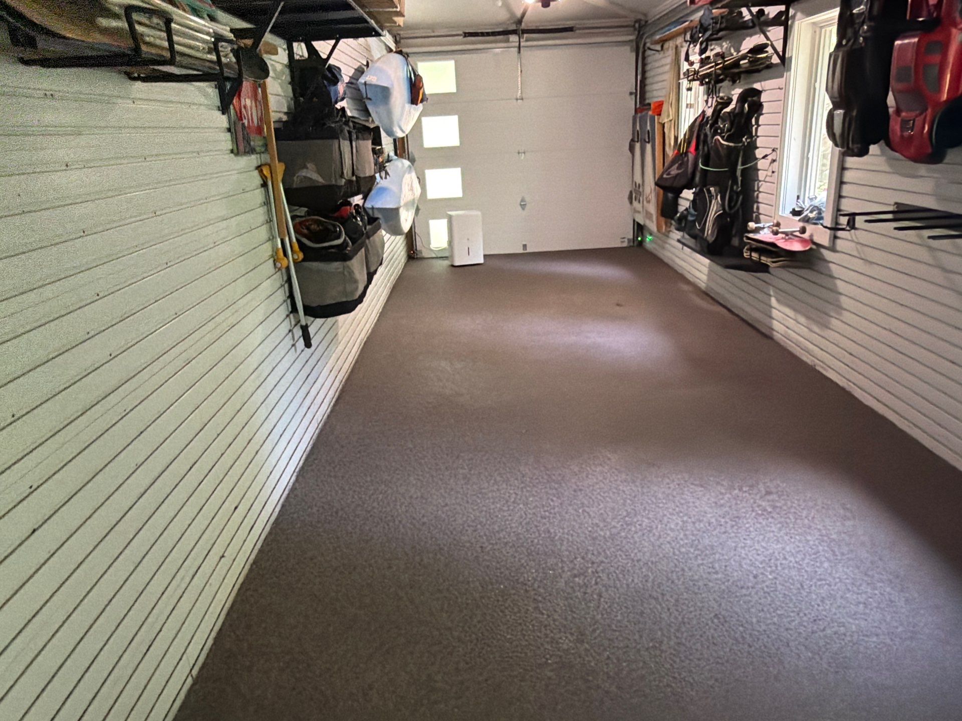 Residential Garage Epoxy Flake Floor Installation in Grand Haven by Gordon Painting