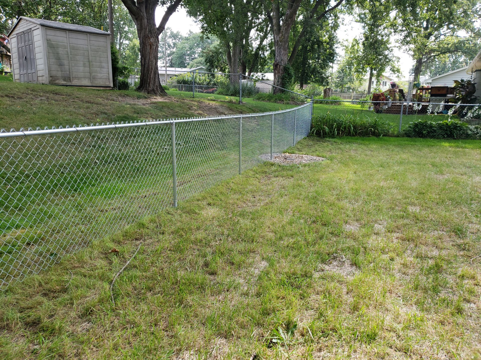 Galvanized Chain Link Backyard Fence and Gate Installation in Cedar Falls by Perfect Picket Fence and Stain
