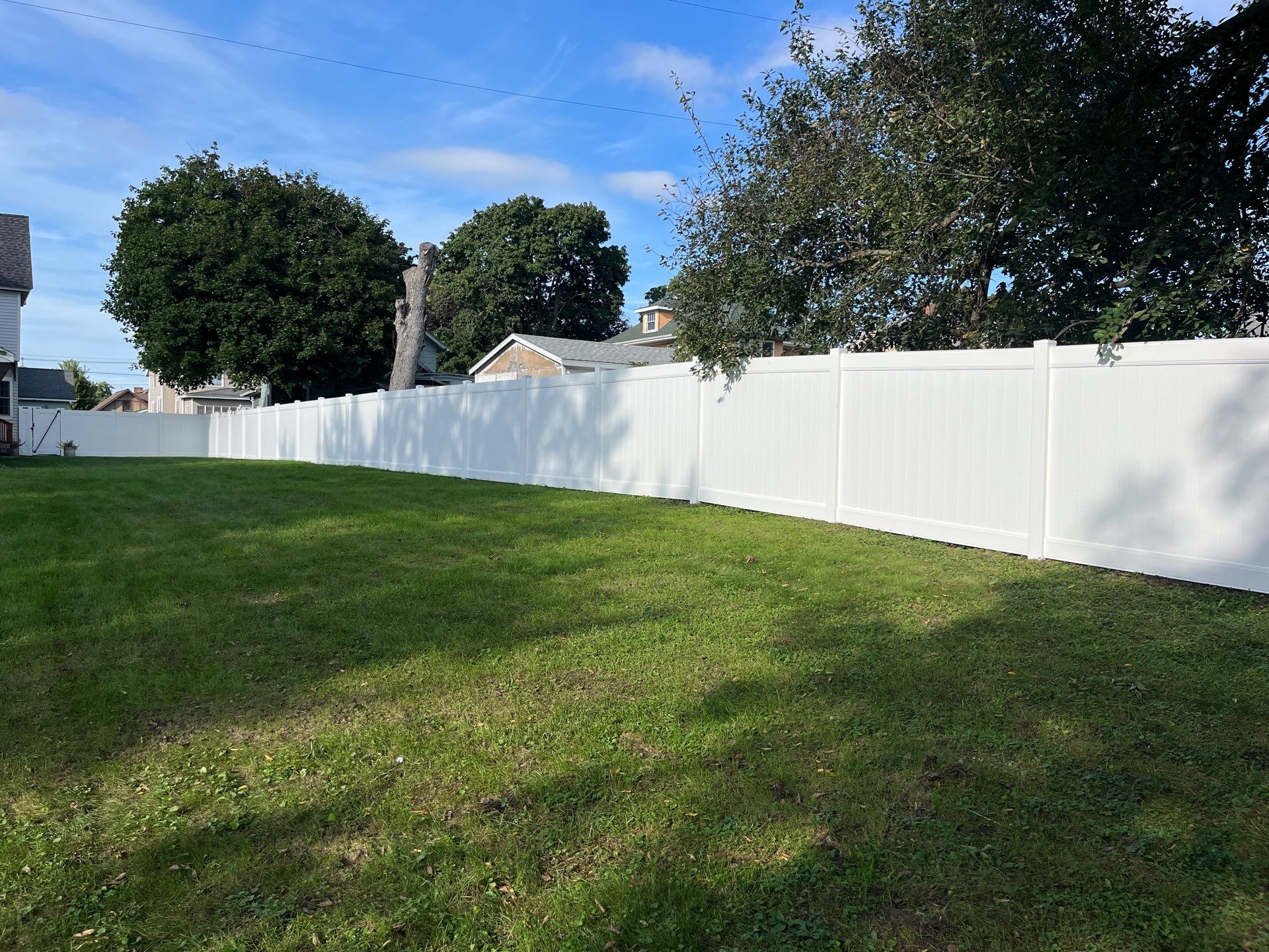 White Vinyl Privacy Fence and Black Chain Link Installation in Sumner by Perfect Picket Fence and Stain