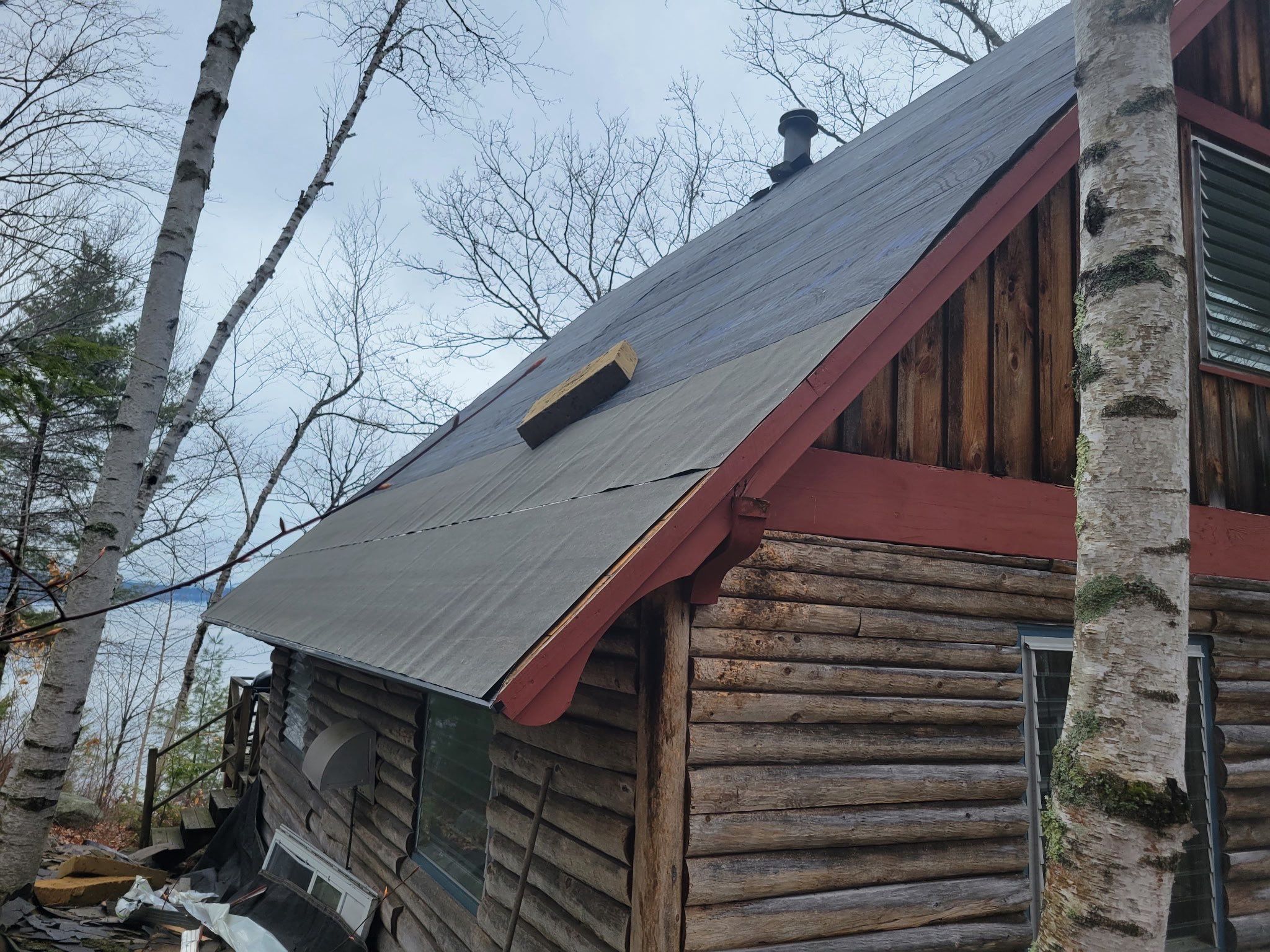 Asphalt Shingle Roof Replacement for Raymond Lakefront A-Frame Cabin by Tall pine roofing