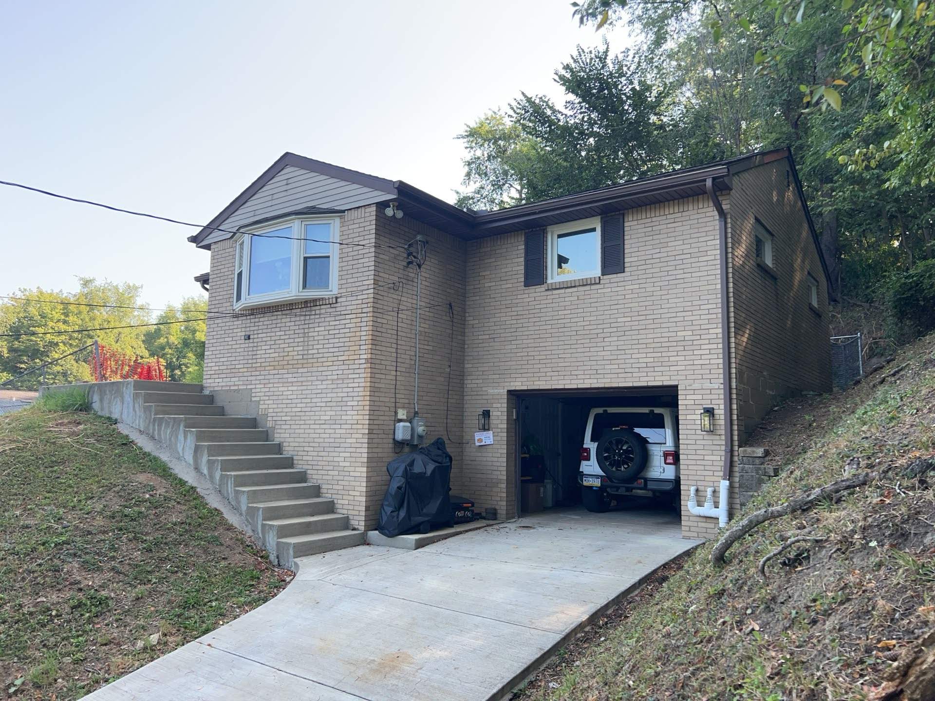 White Brick Exterior Painting and Dark Trim Transformation in Pittsburgh by Ideal Siding Pittsburgh