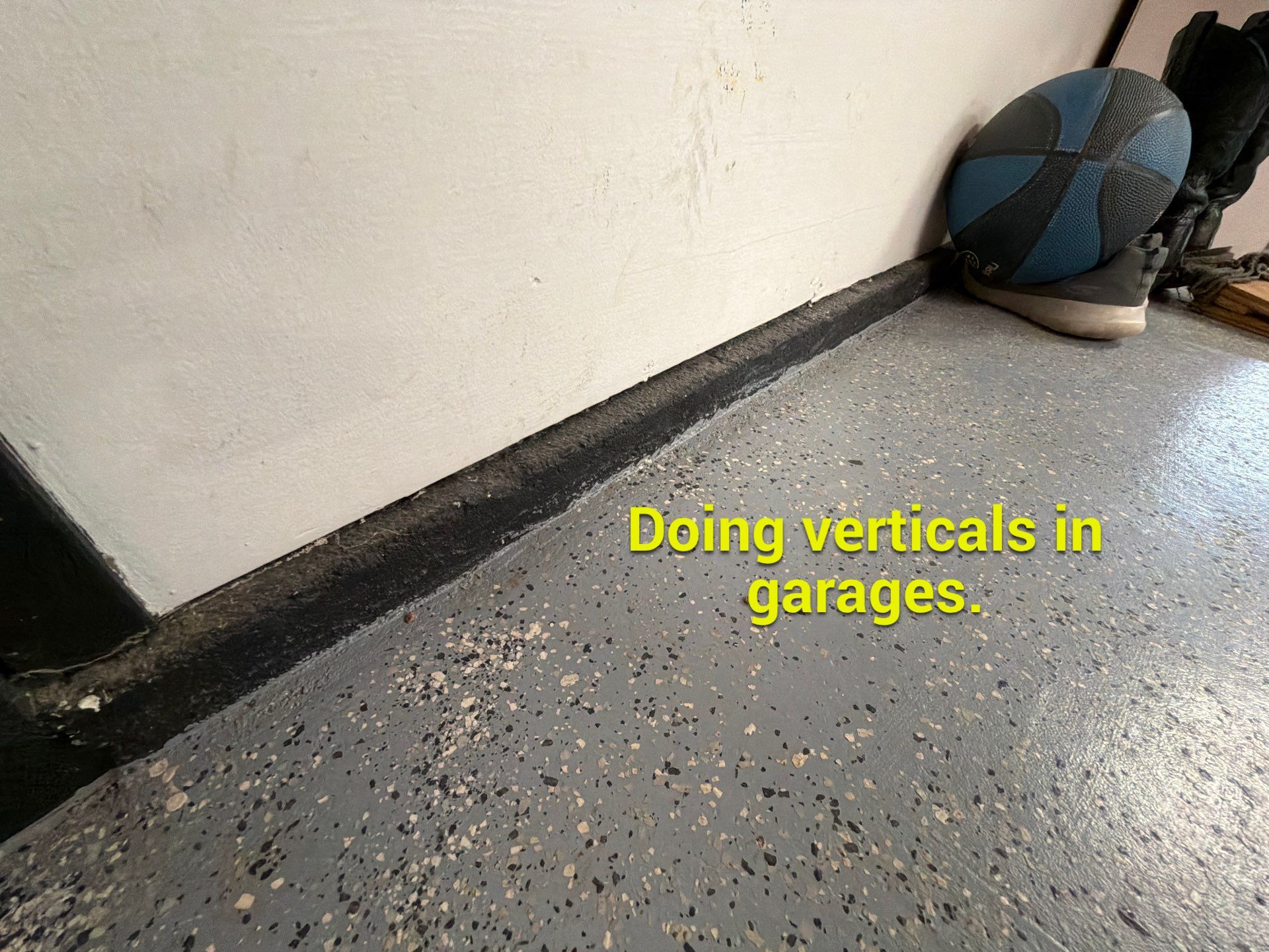 Custom Grey Flake Epoxy Garage Floor Installation in Remsen by Select Painting, Coatings & Garage Cabinets