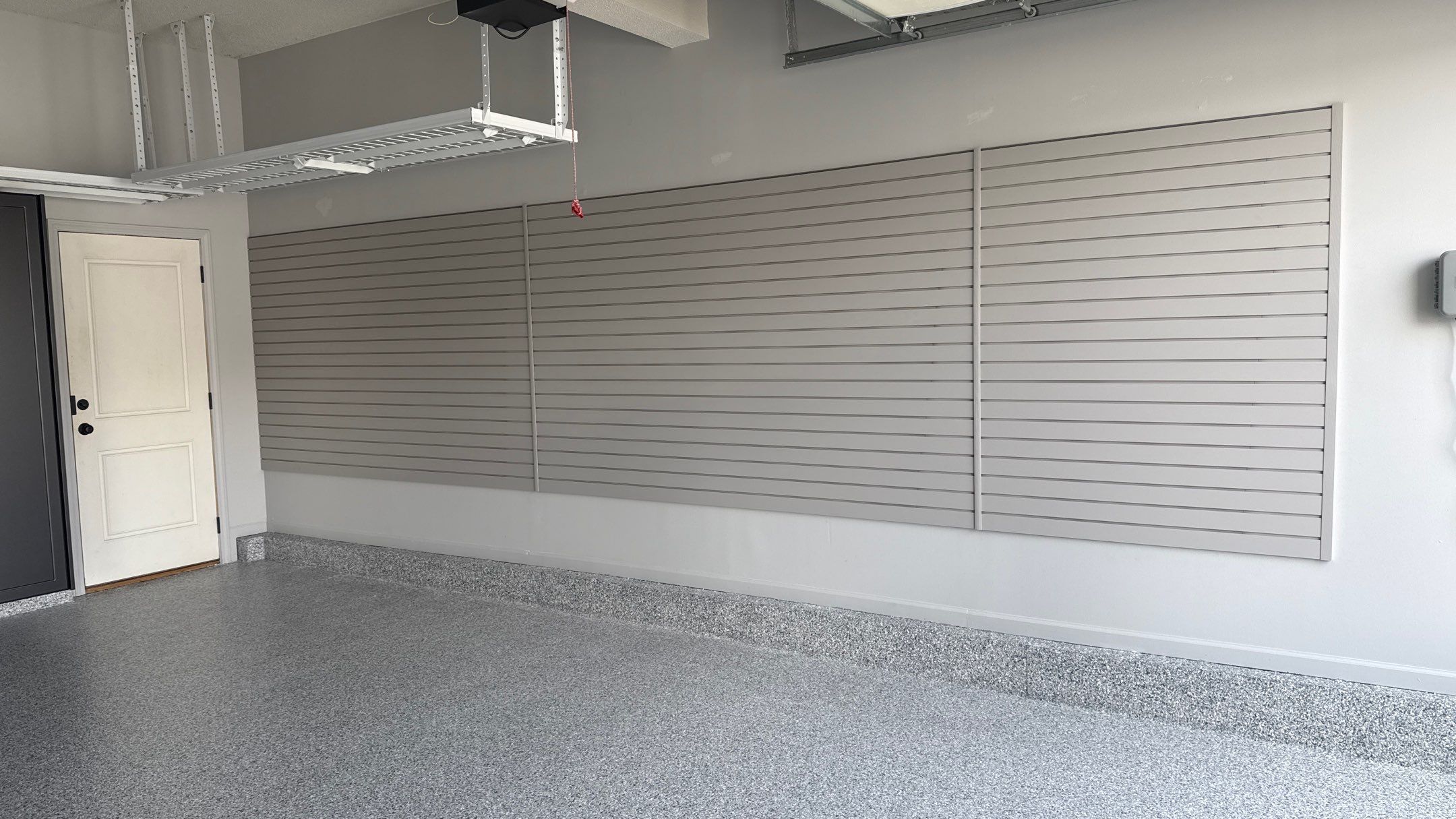 Comprehensive Garage Renovation Featuring Epoxy Flooring and Custom Storage in Shawnee by Banner Garage