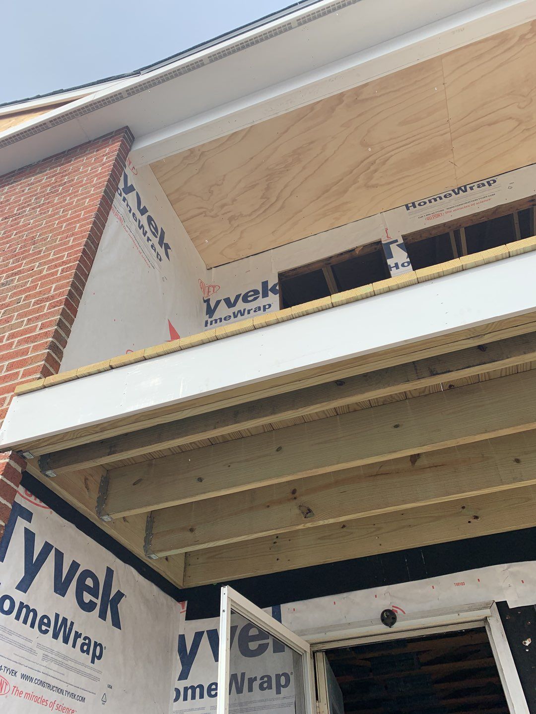 Commercial Roofing Installation using EPDM with white gutters by A Plus Exterior