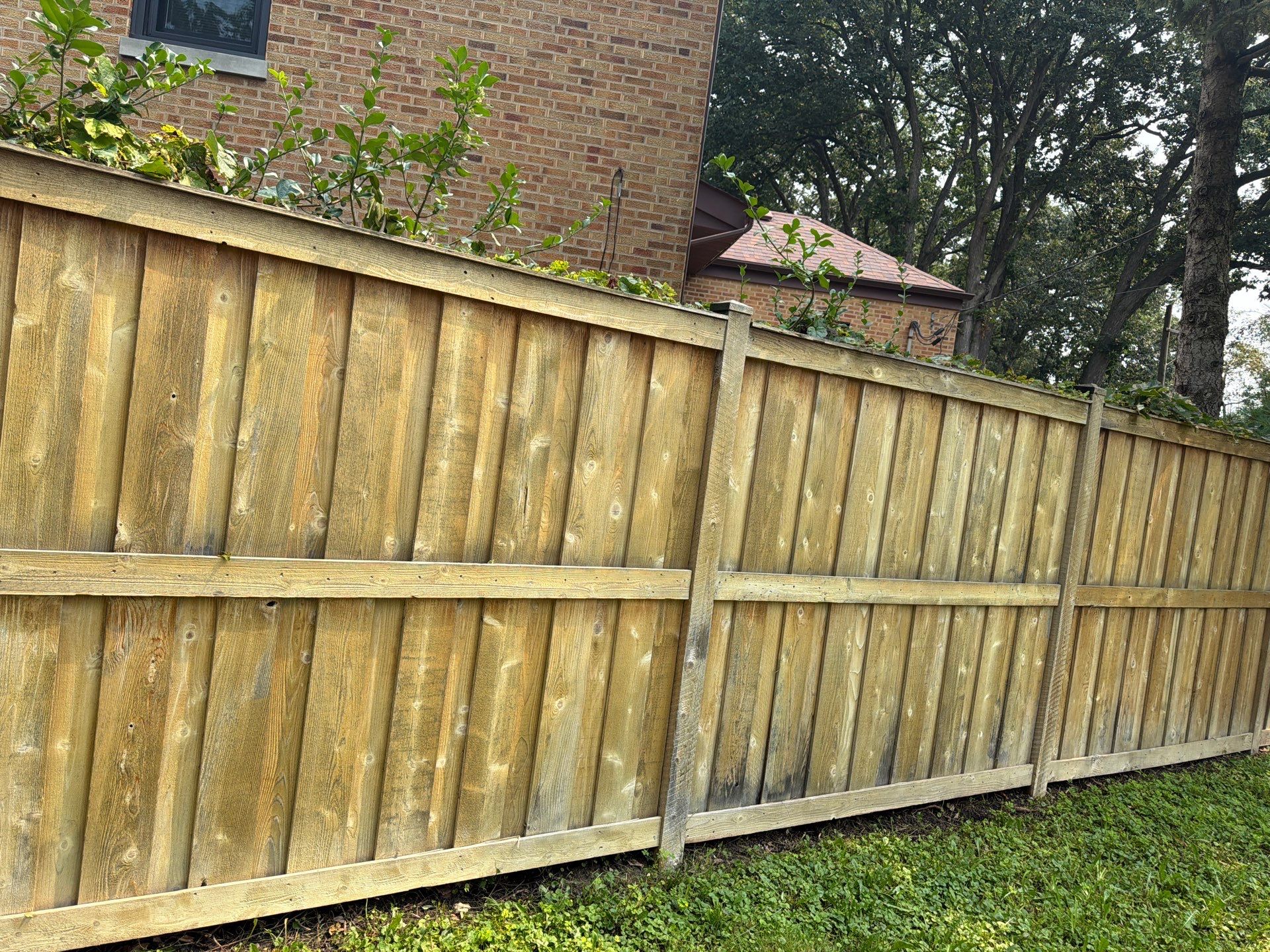 Wood fence cleaning and sealing by Northern Power Washing LLC.