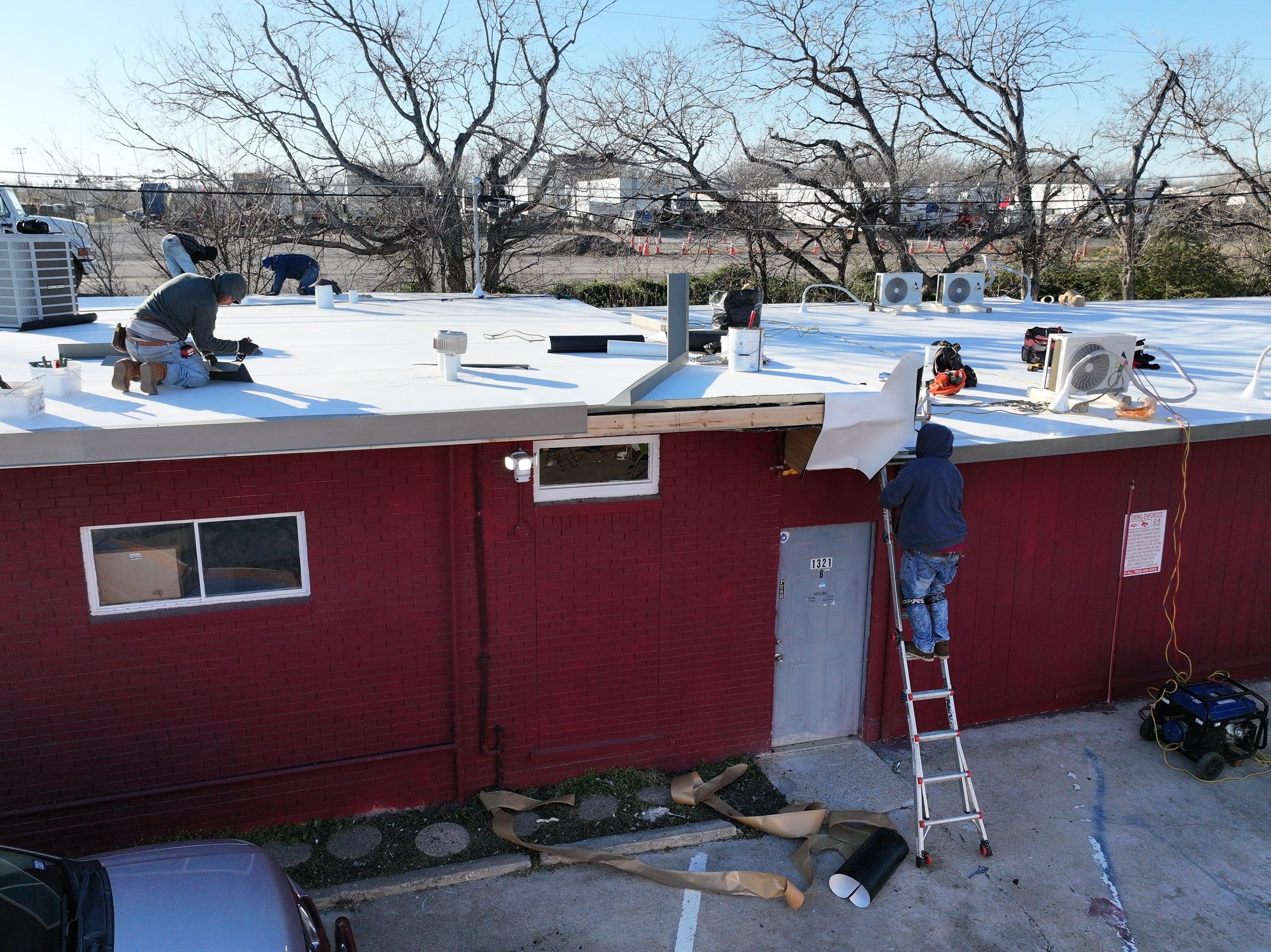 Commercial roofing overlay using GAF TPO over an old ballast roof by Becker Roofing and Exteriors
