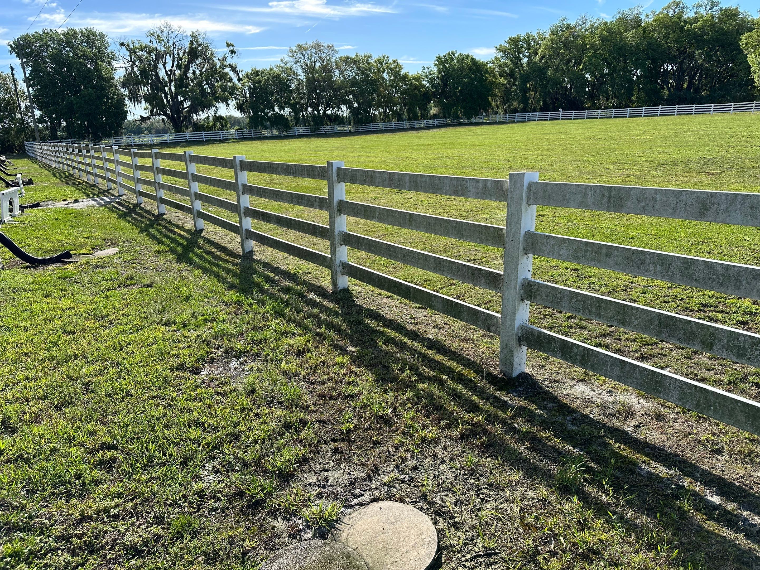 Vinyl Horse Fence & Concrete Pier Cleaning at Lesley Cox Equestrian, Parrish, FL | Sunshine AquaWash by Sunshine AquaWash