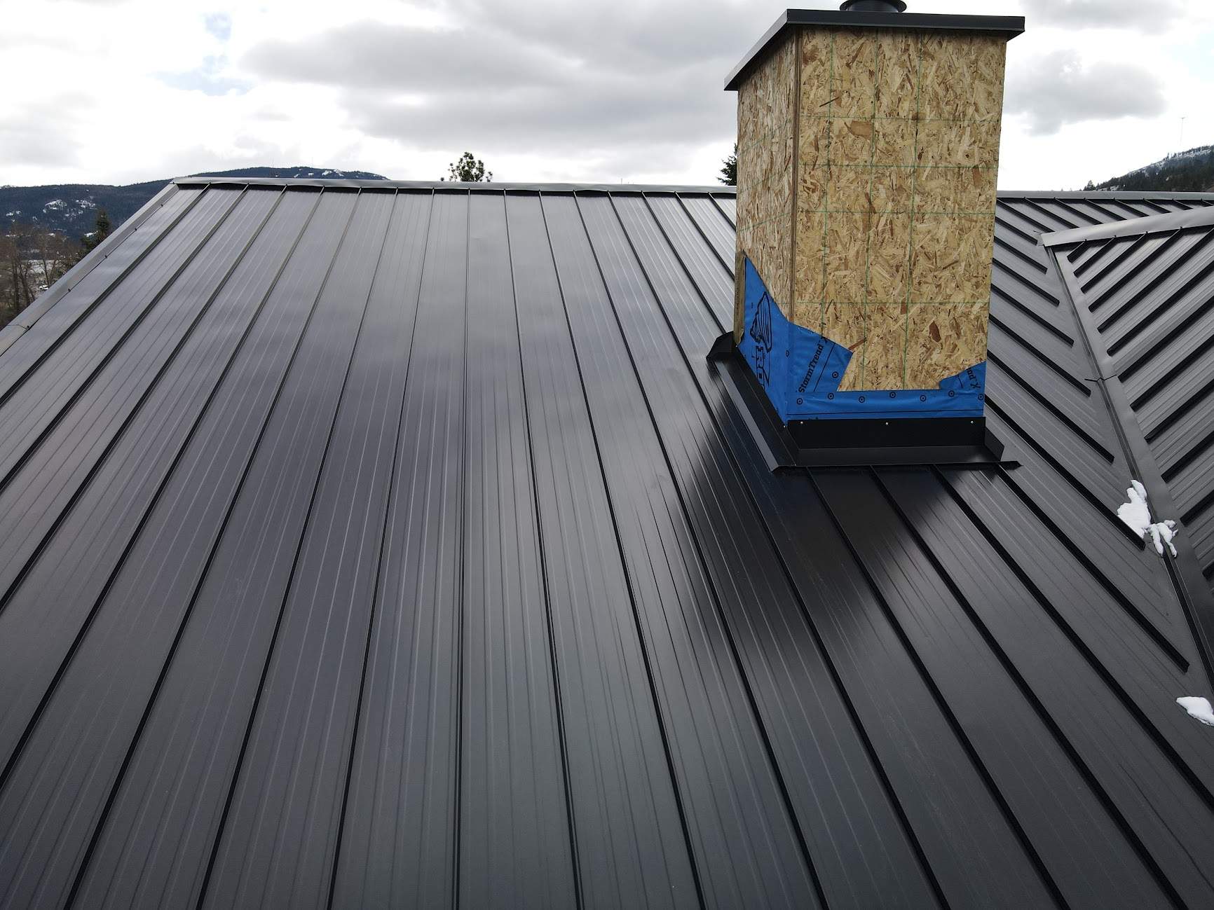 Residential Roofing Installation using 12" Prolok metal  by Top Notch Roofing Inc