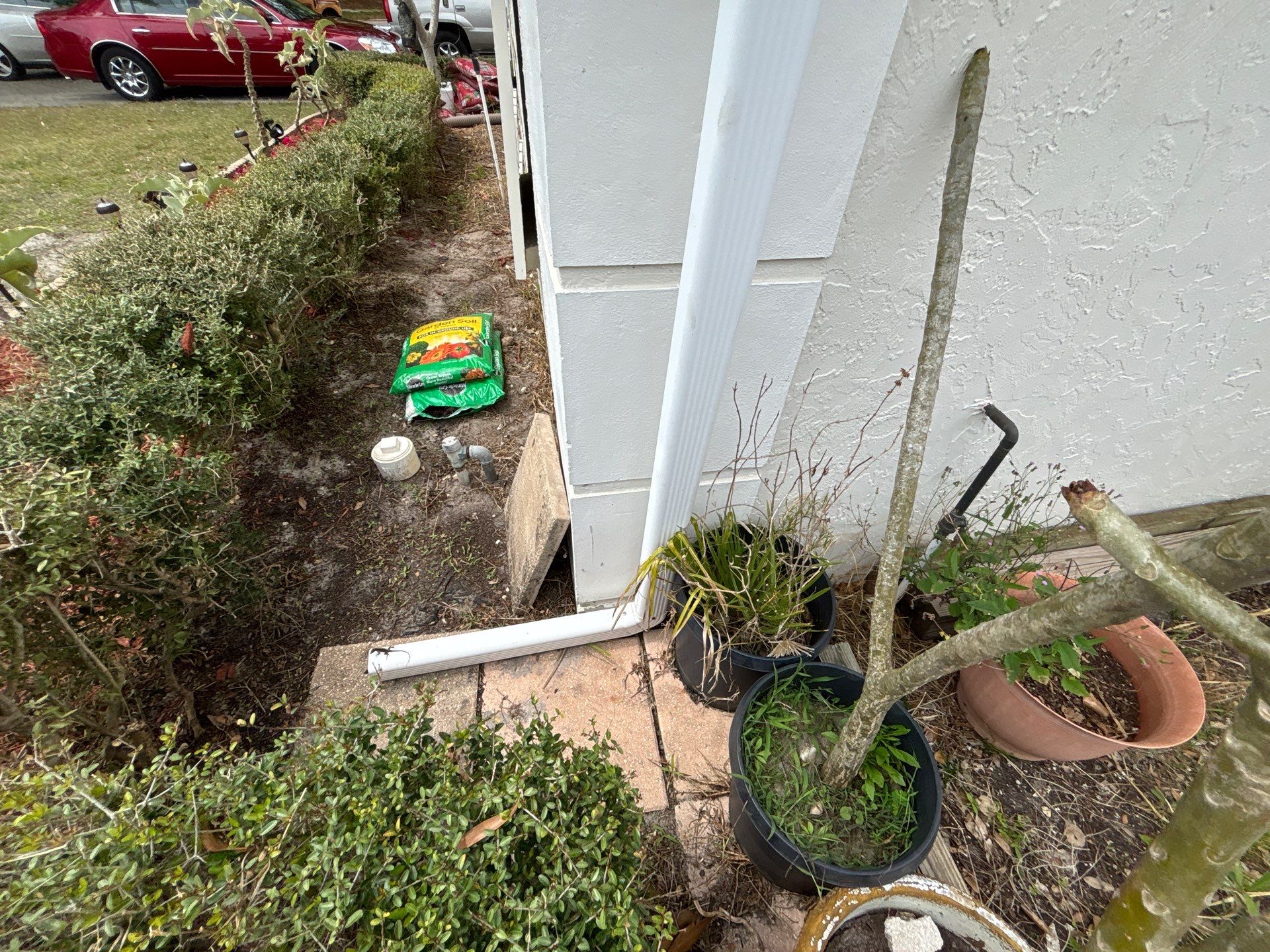 Gutter Project with White 6-K Seamless Gutters Installation and Downspouts in Sarasota FL by Gutter Professors