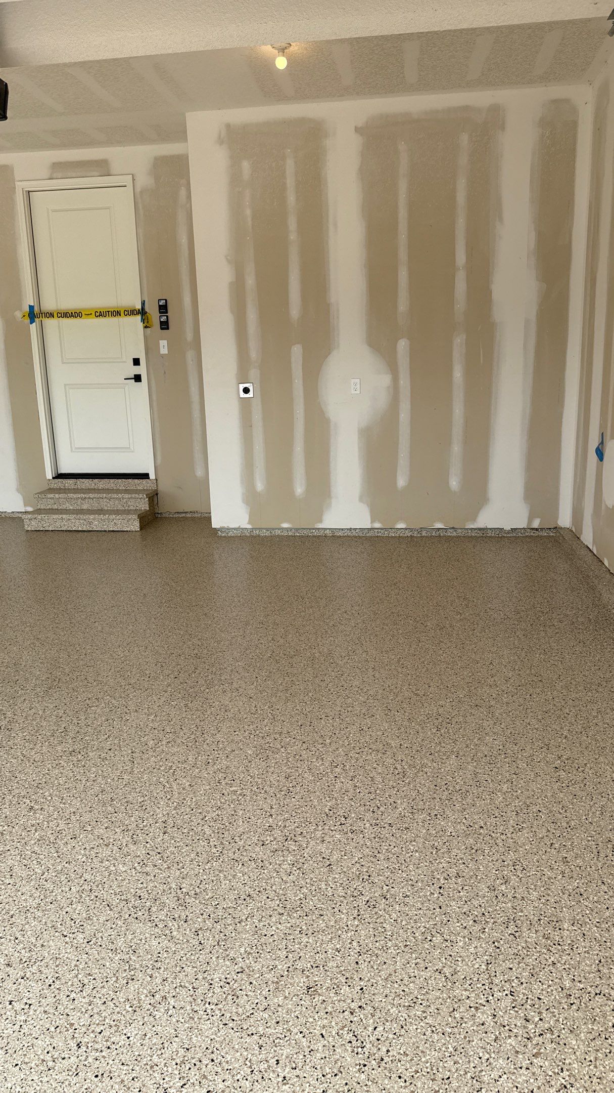 Raymore Garage Finishing With Custom Epoxy Floor Coating by Banner Garage