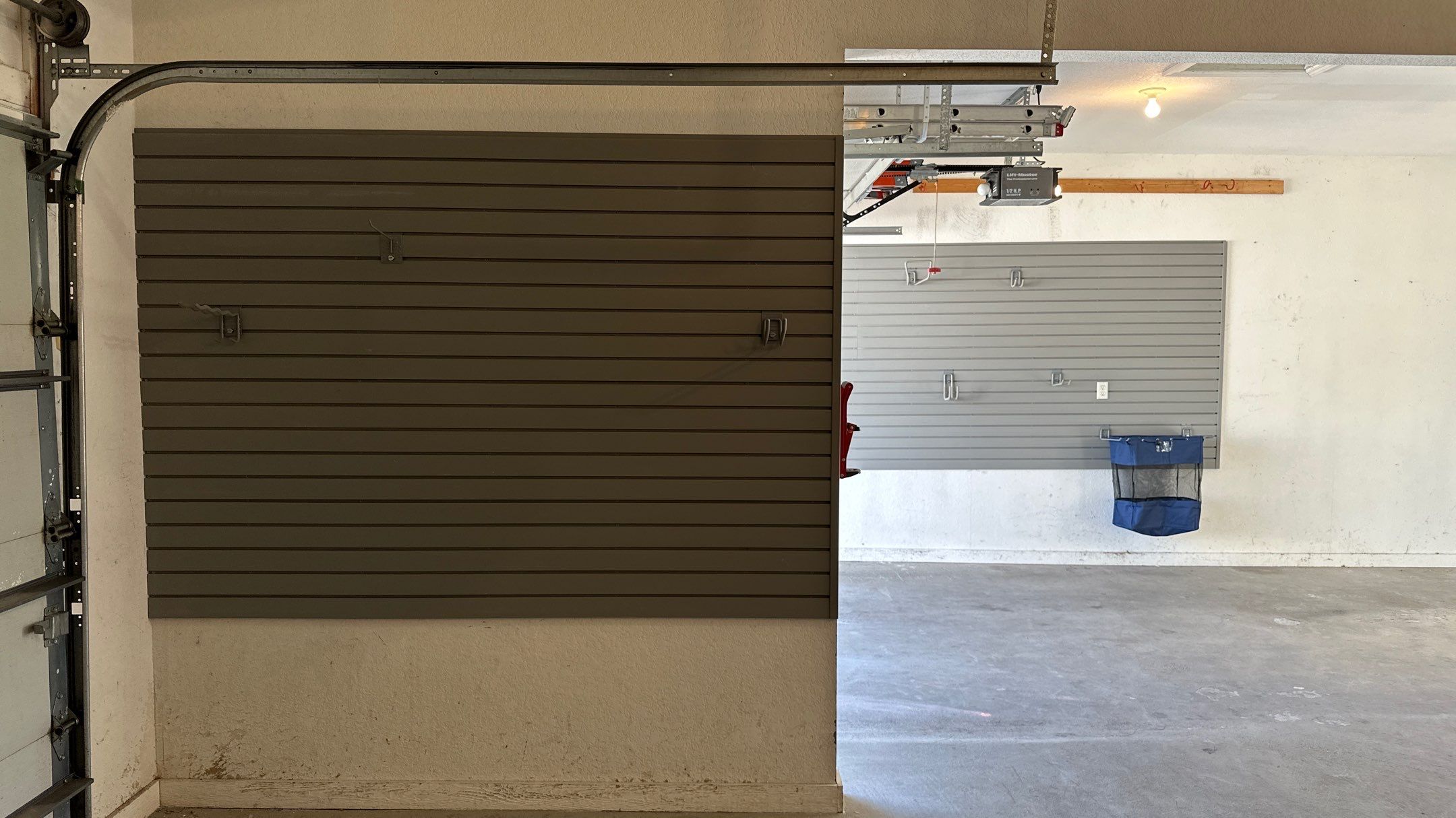 Melissa L. upgraded her garage with slatwall and overhead racks by Banner Garage